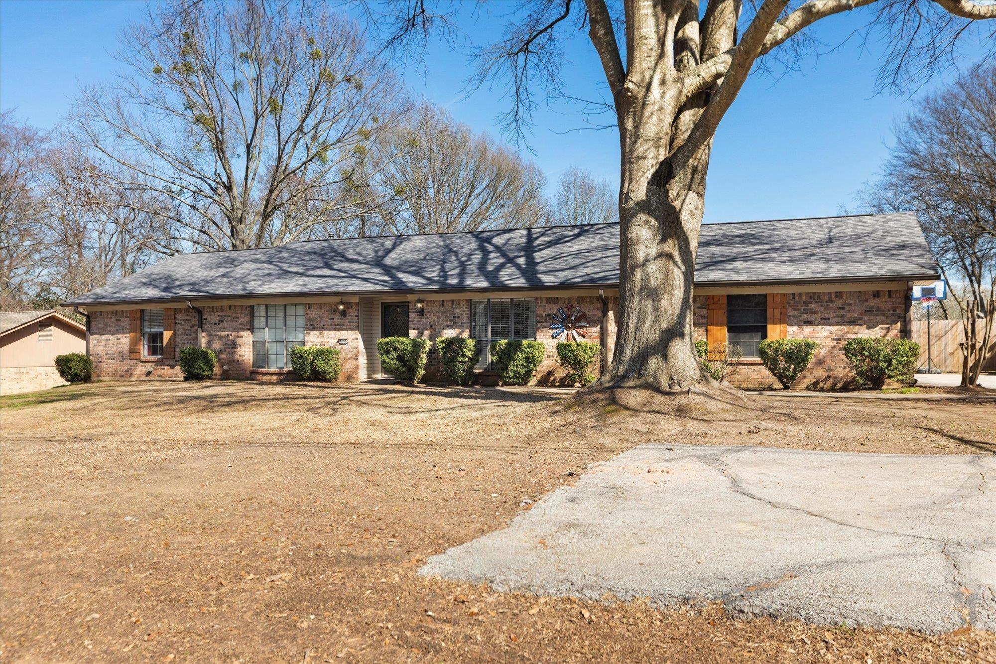 Image 2: Single story home featuring brick siding, Front Of Structure