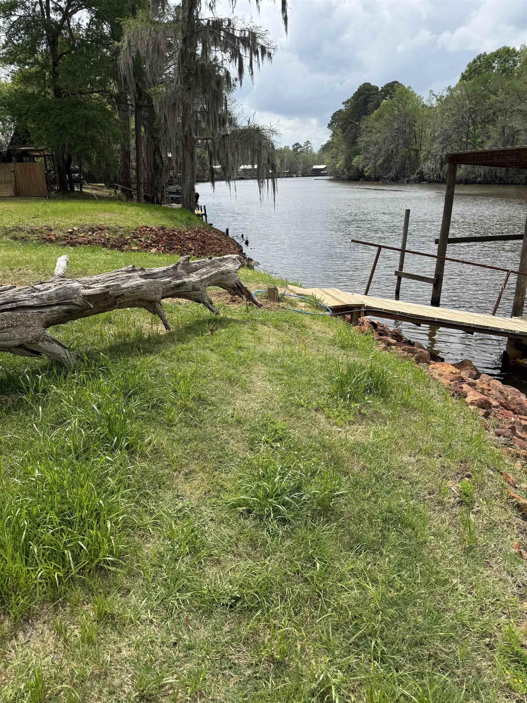 Image 3: Dock with a yard and a water view, Dock