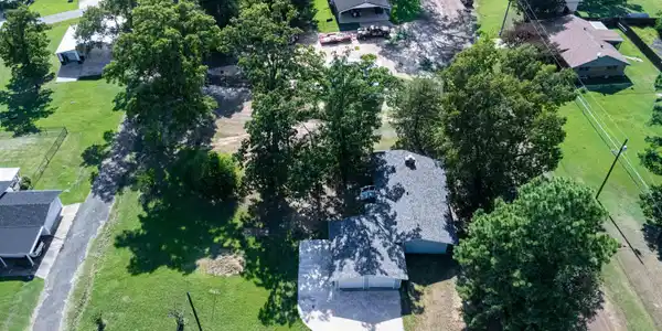 Image 3: Single-story residence featuring an attached two-car garage and a concrete driveway, Aerial View