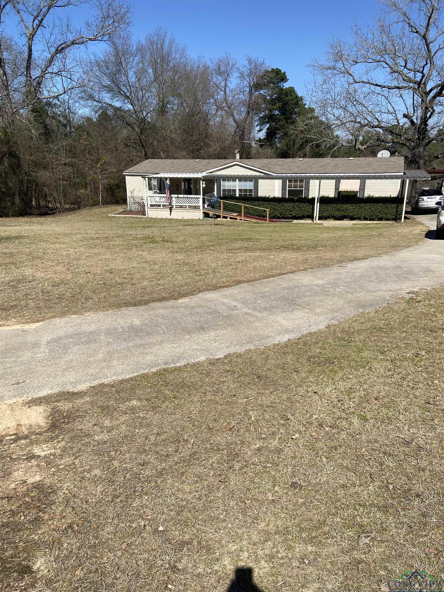 Image 1: View of front of house featuring a front lawn, Front Of Structure