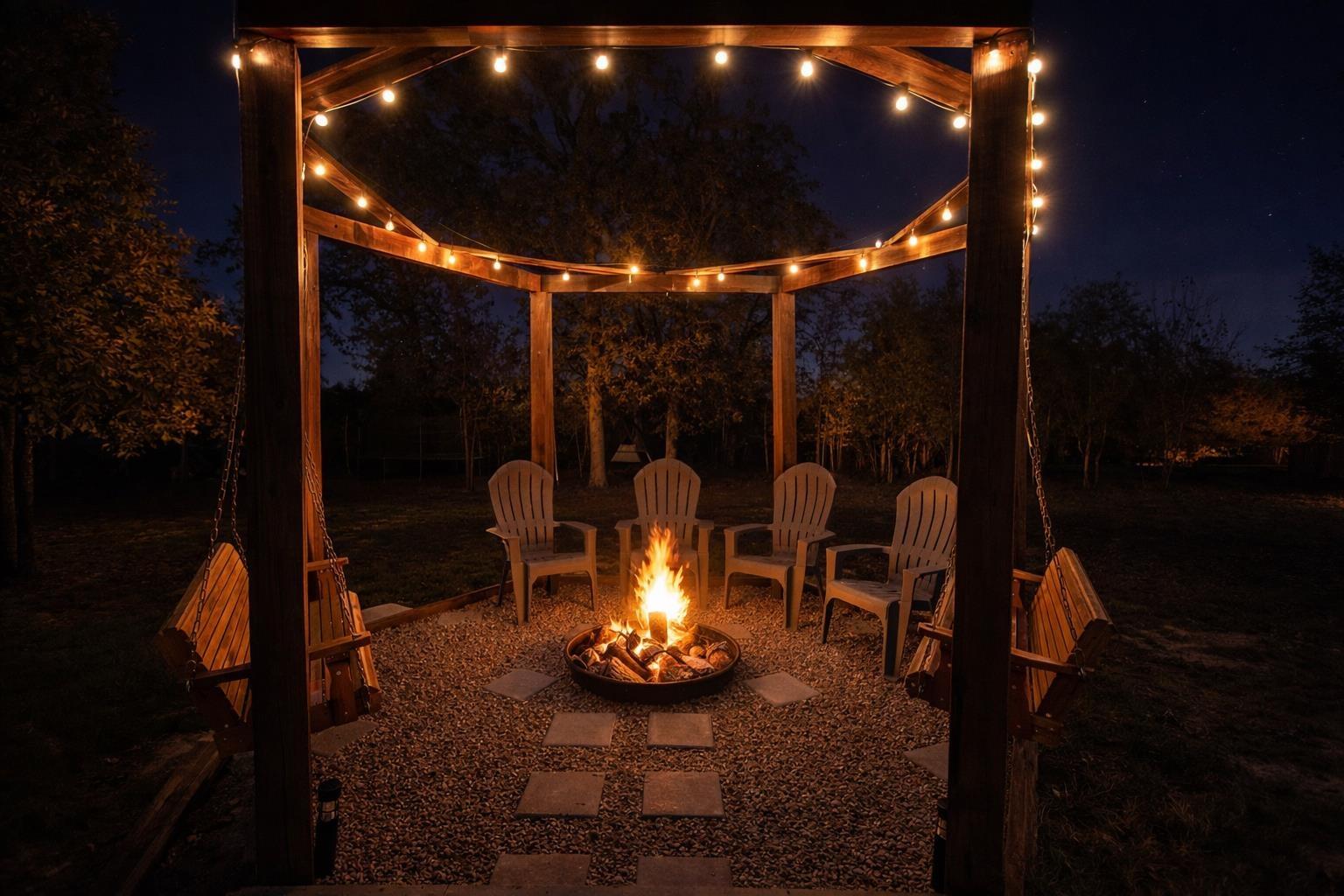 Image 1: Patio at night with a patio and an outdoor fire pit, Patio