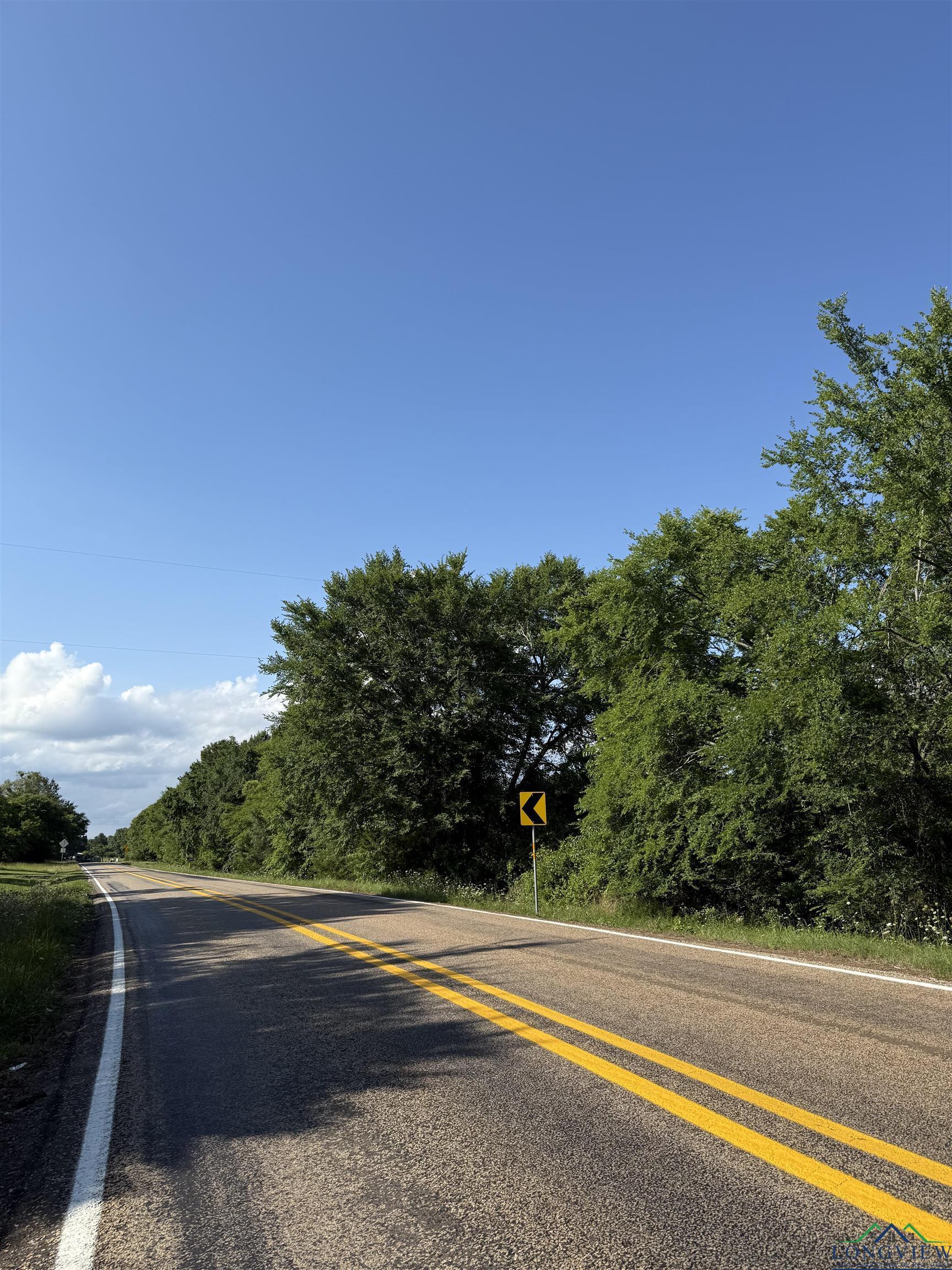 Image 1: View of asphalt road, Community