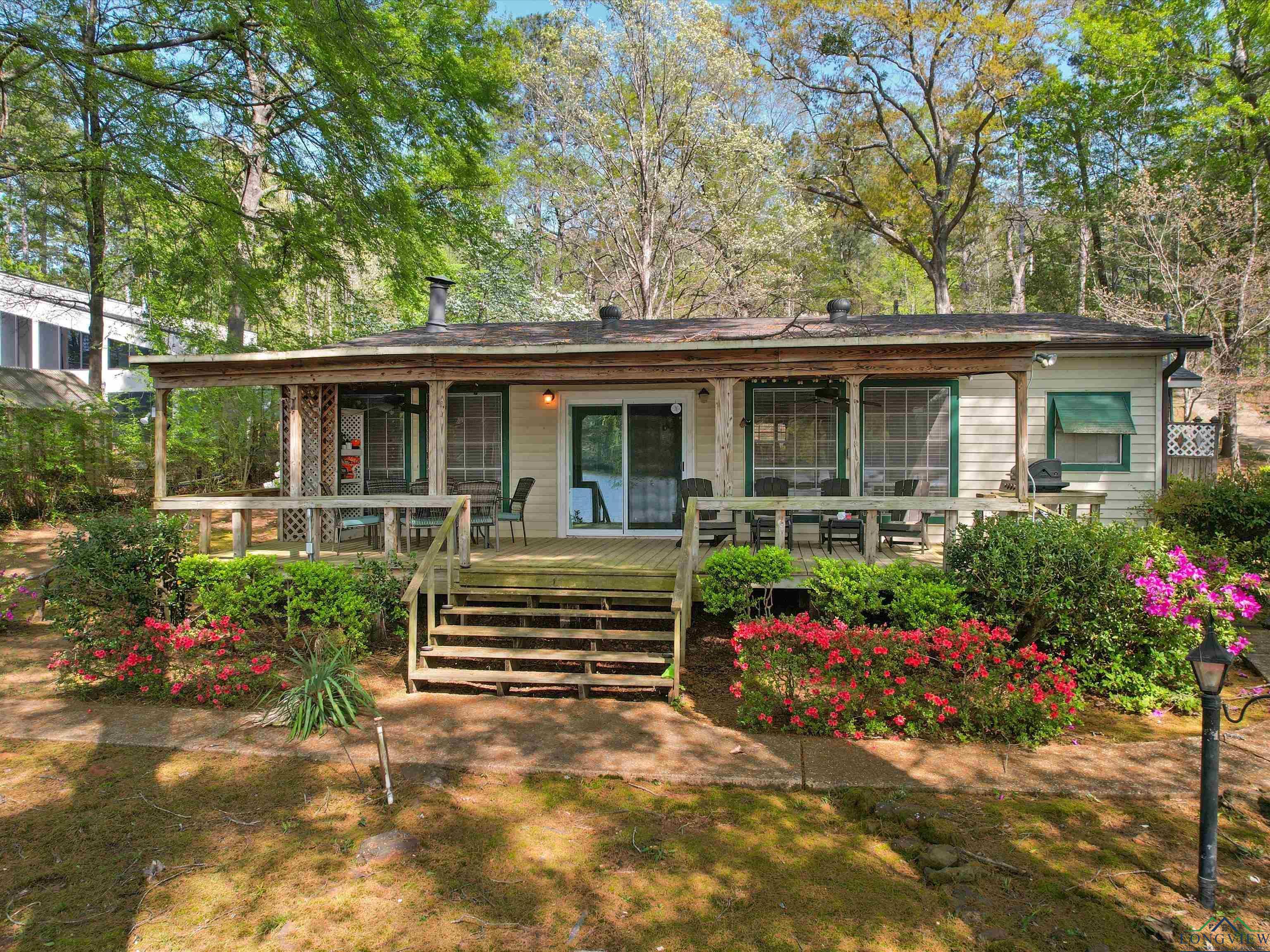 Image 2: View of front of house with a deck, Front Of Structure