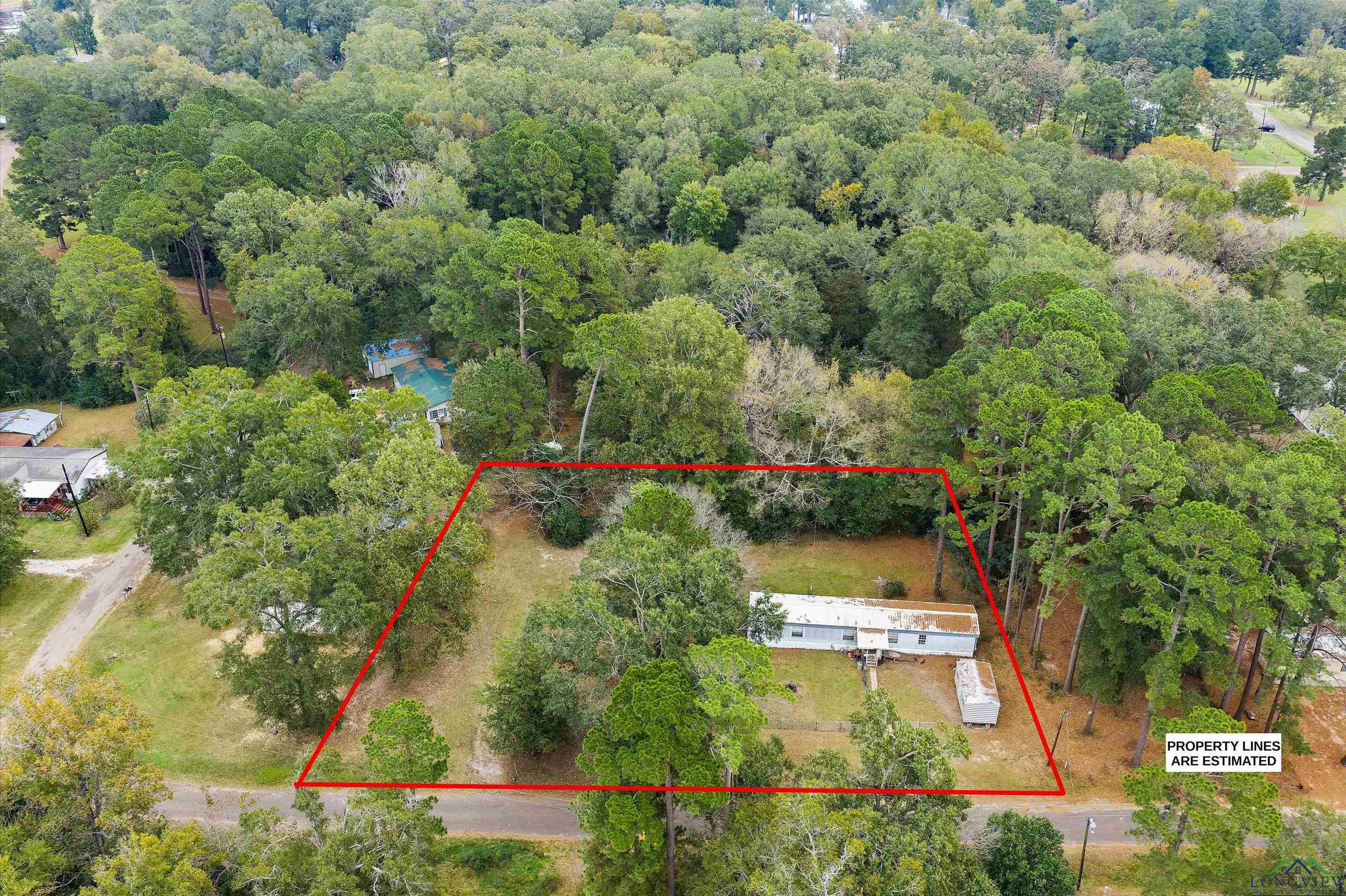 Image 3: Drone / aerial view of a heavily wooded area, Aerial View