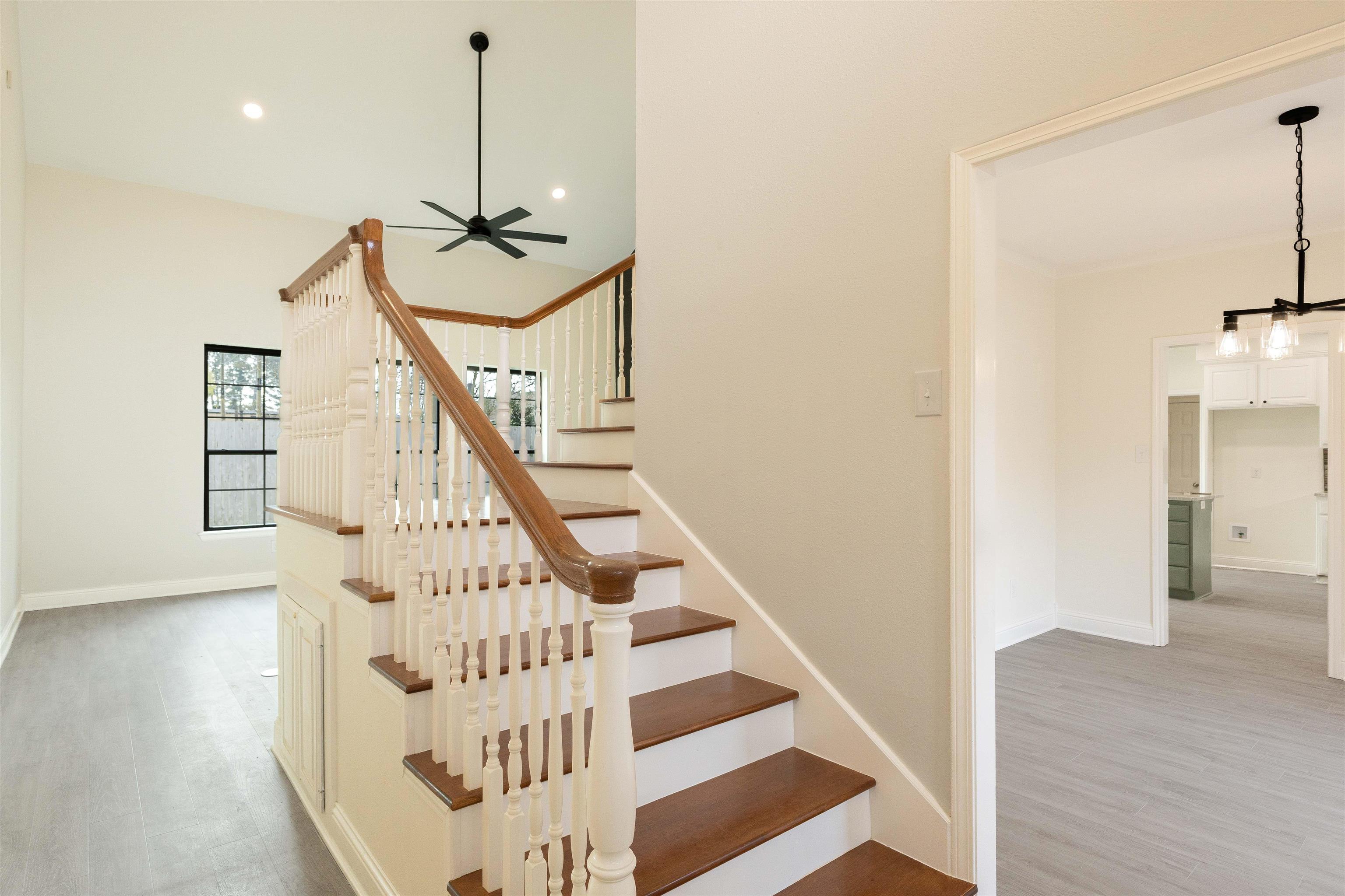 Image 2: Stairs with wood finished floors, ceiling fan, and recessed lighting, Stairs