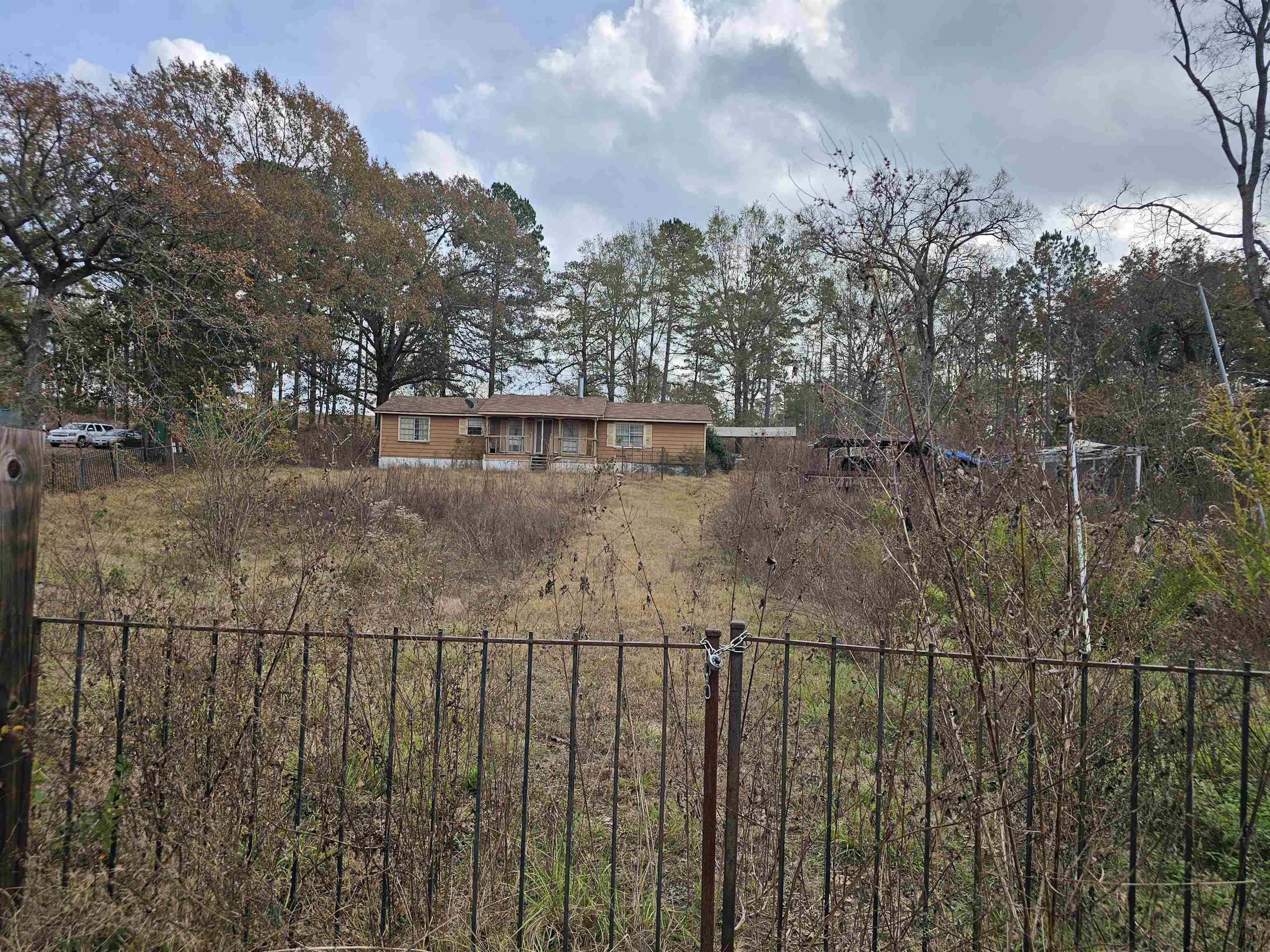 Image 3: View of yard with view of wooded area, Yard