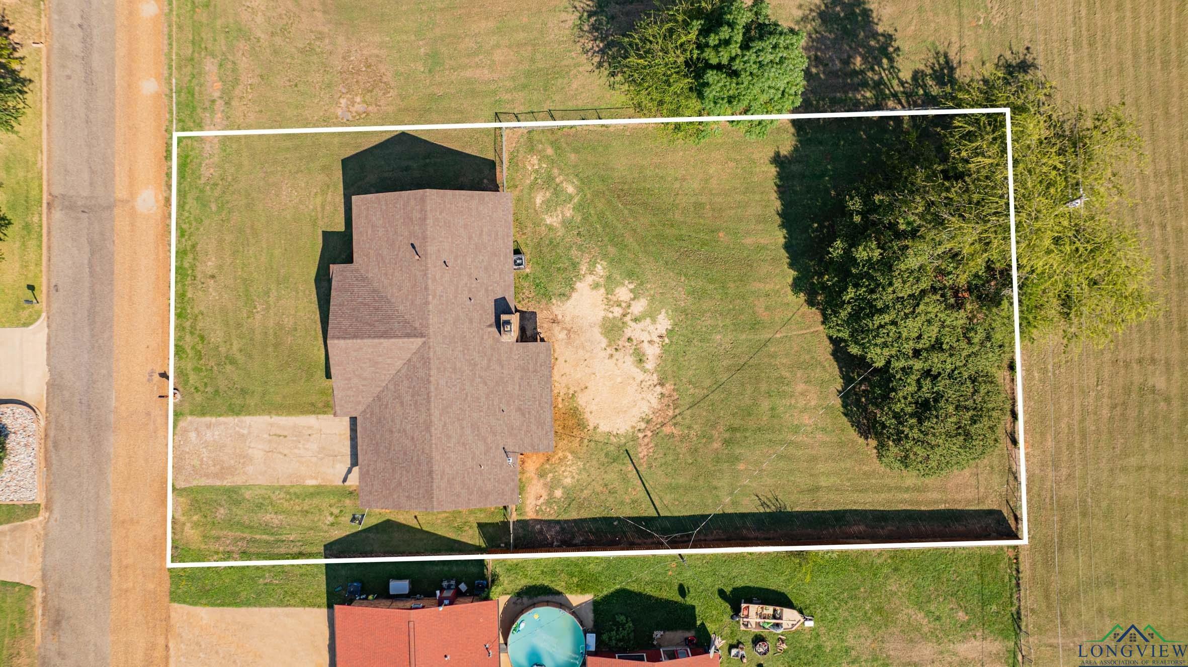Image 2: Aerial overview of property's location featuring property parcel outlined, Aerial View