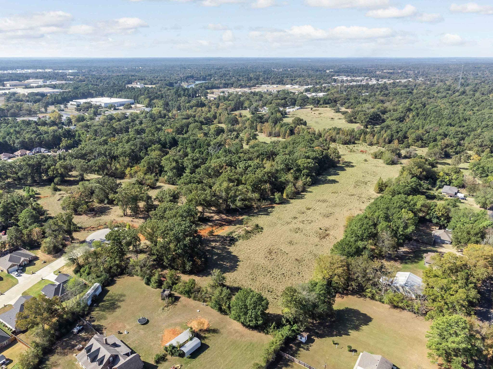 Image 3: View of property location featuring a forest, Aerial View