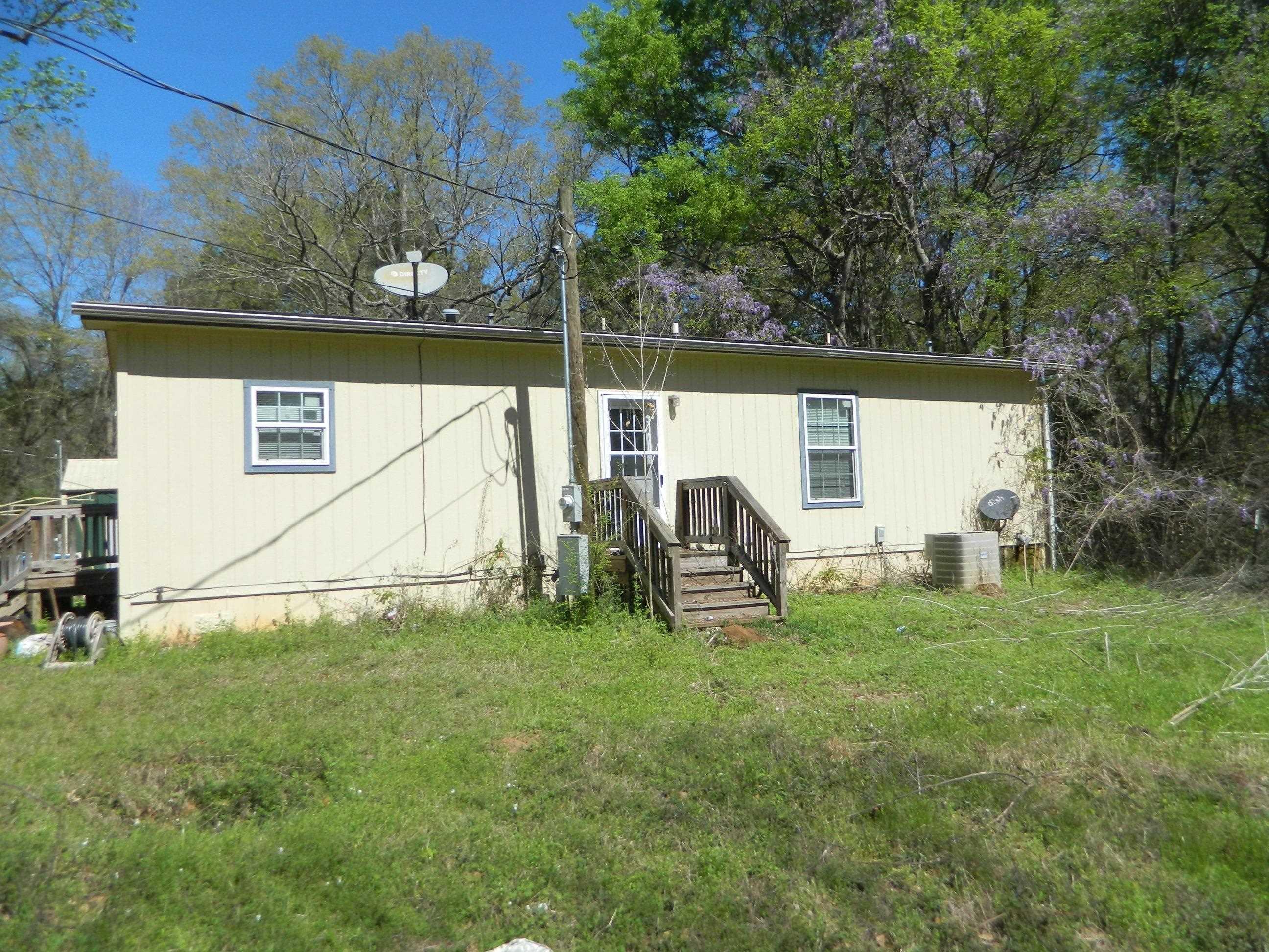 Image 1: Rear view of house with a yard, Back Of Structure