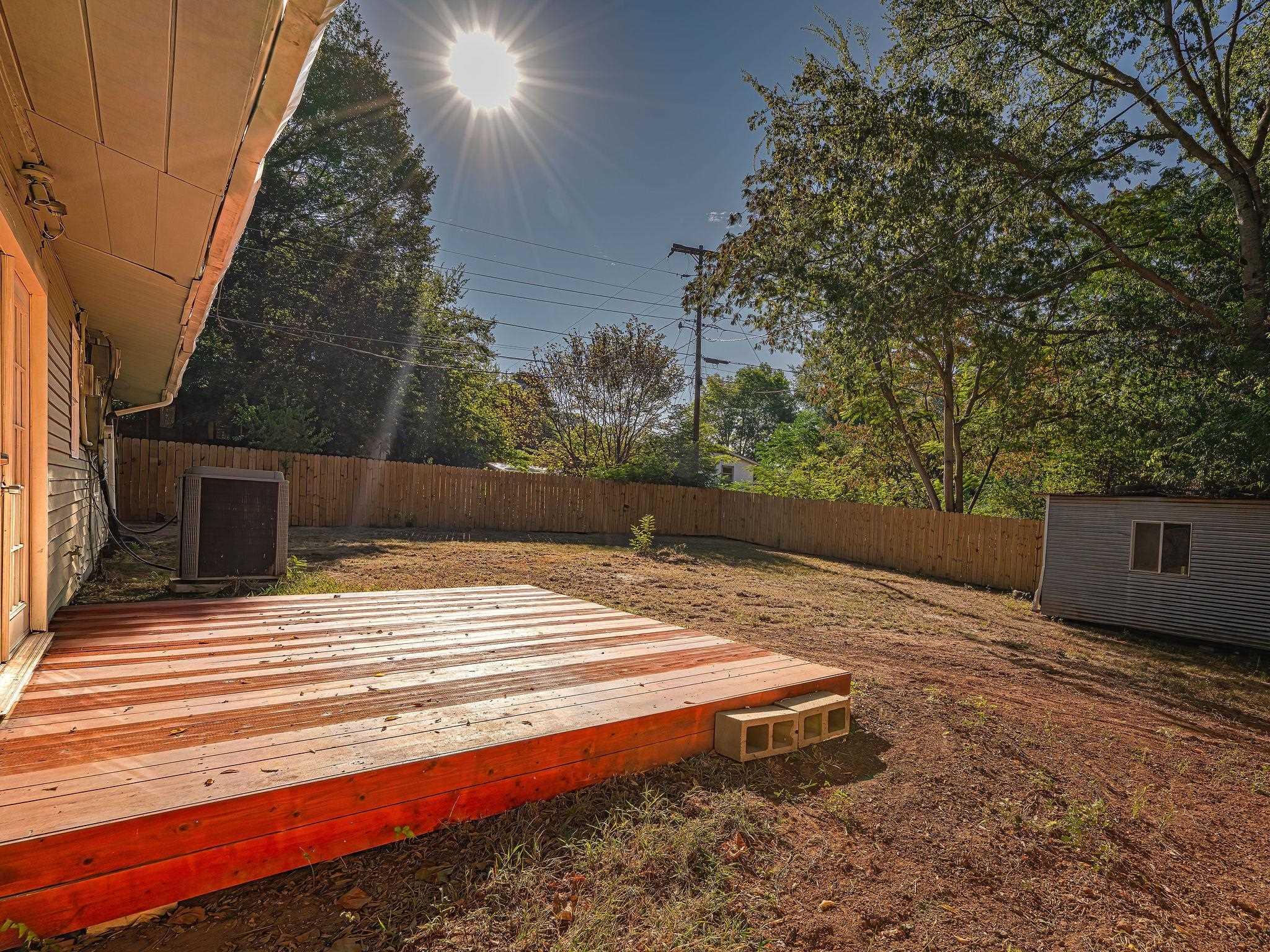 Image 2: Deck with a fenced backyard and an outbuilding, Deck