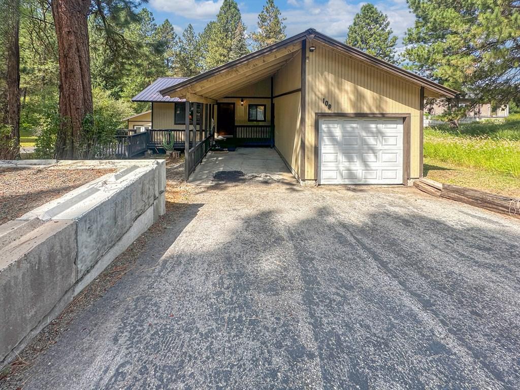 Image 3: Front of Home & Single Car Garage