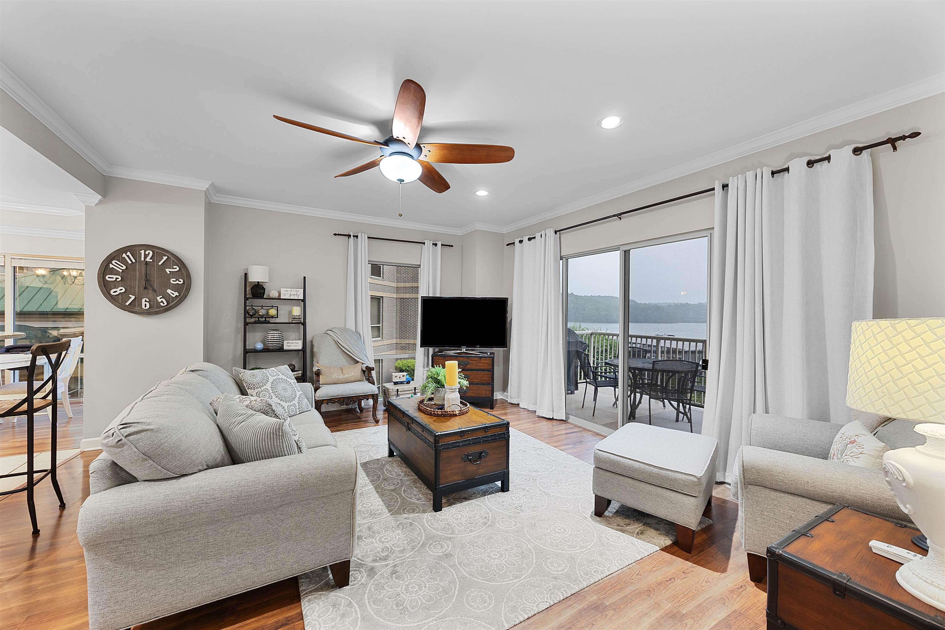 Image 2: Living room featuring ceiling fan, light wood-style floors, ornamental molding, and recessed lighting