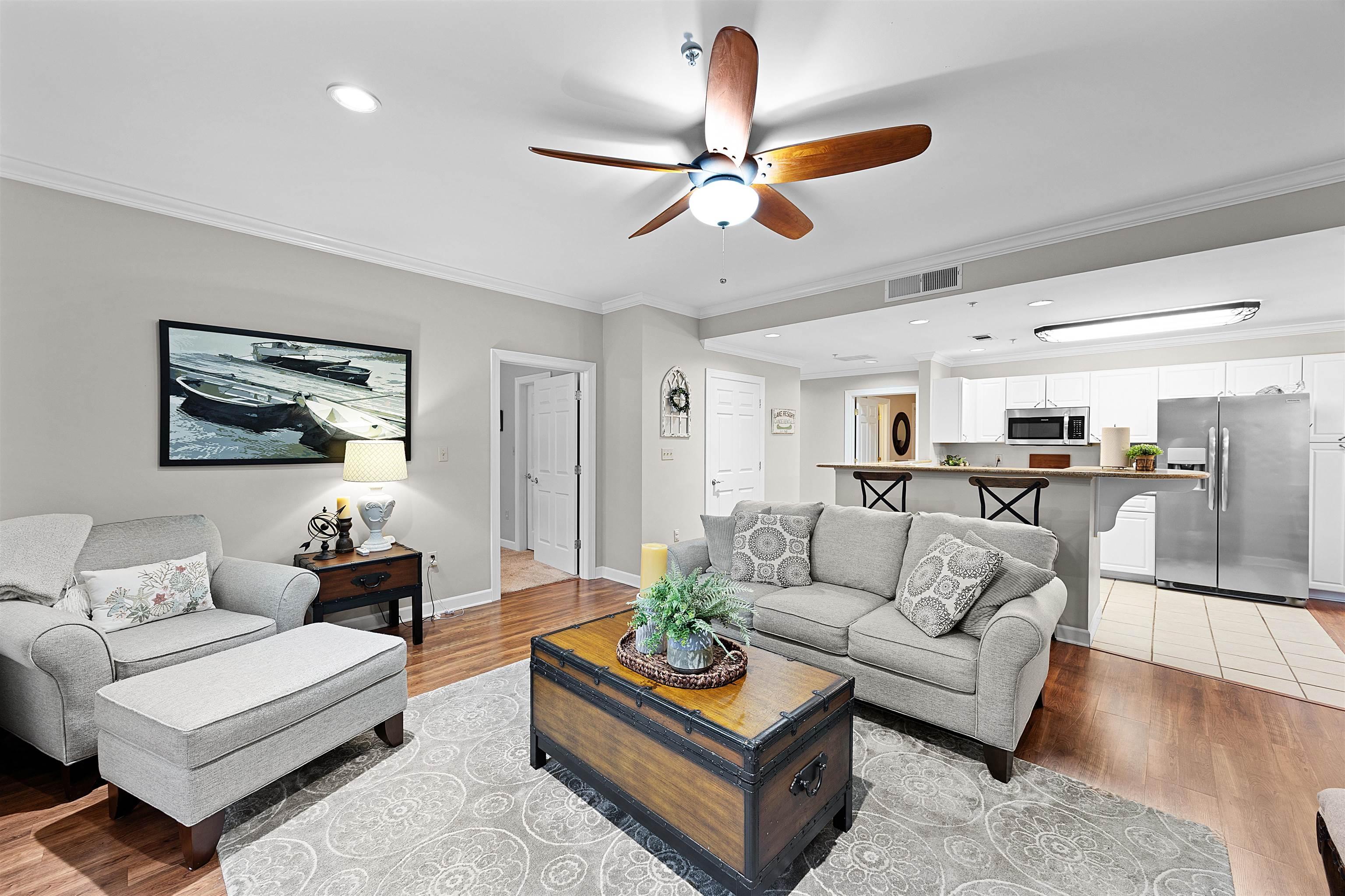 Image 4: Living room with a ceiling fan, crown molding, recessed lighting, and light wood-type flooring