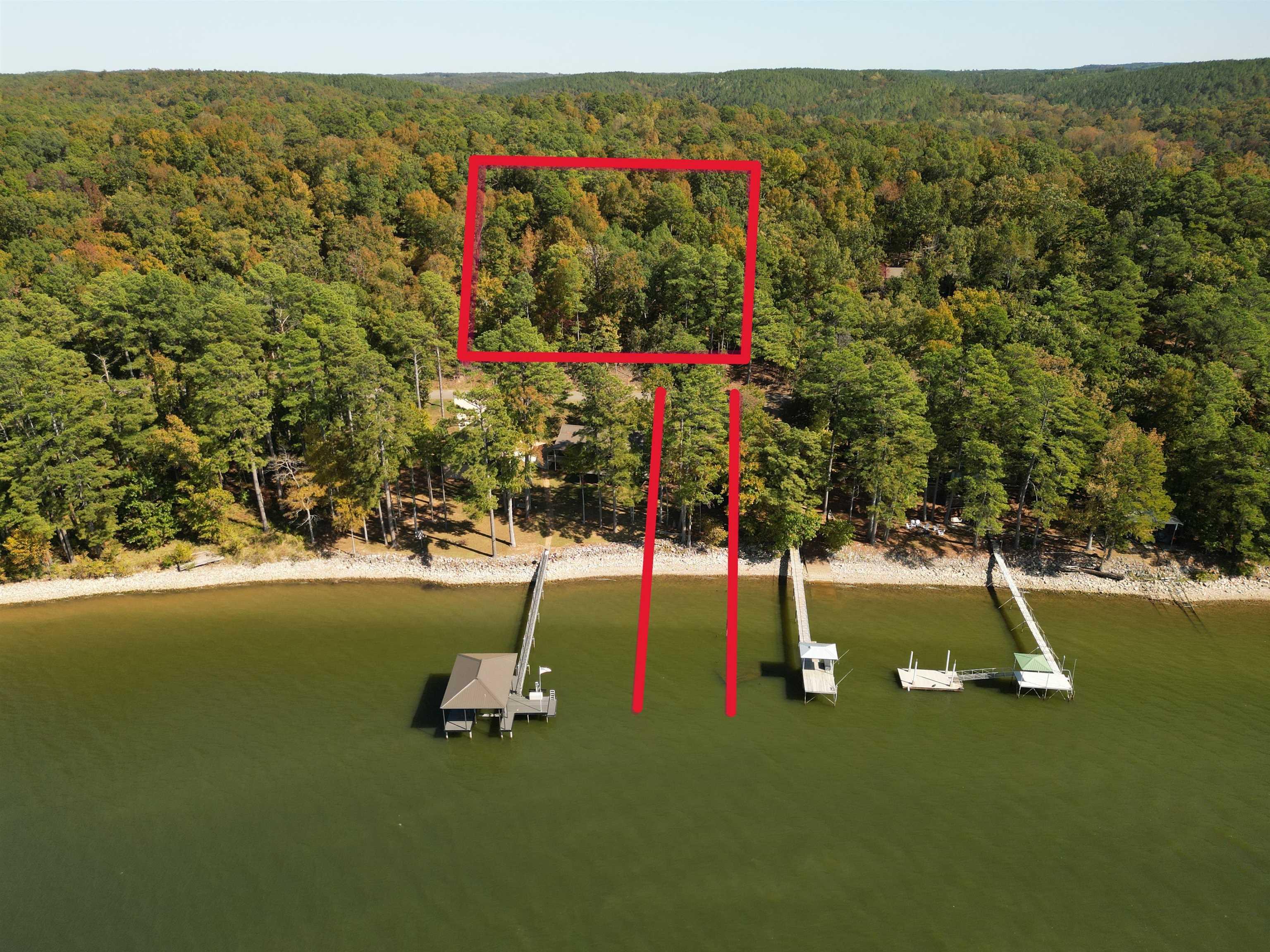 Image 1: View of playground with a water view, a floating dock, and a view of trees