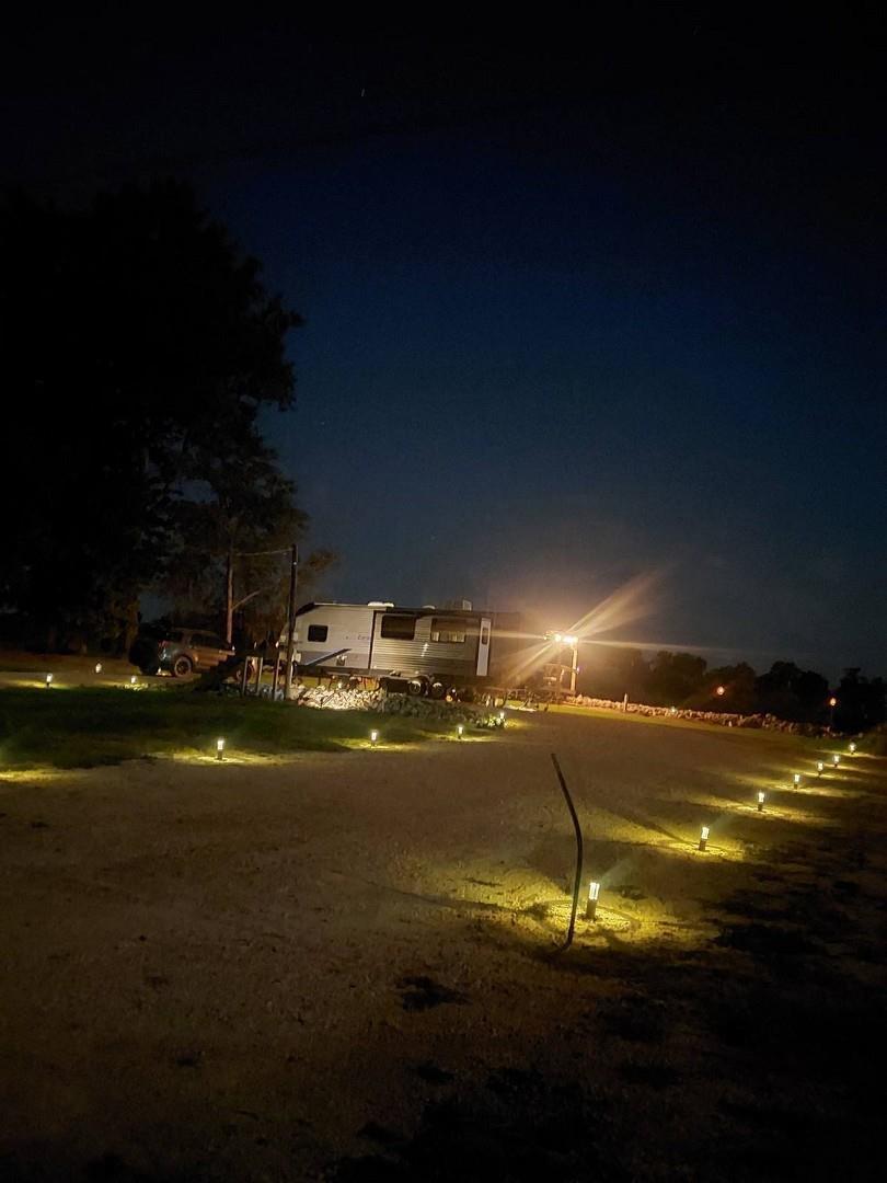 Image 3: View of yard at twilight