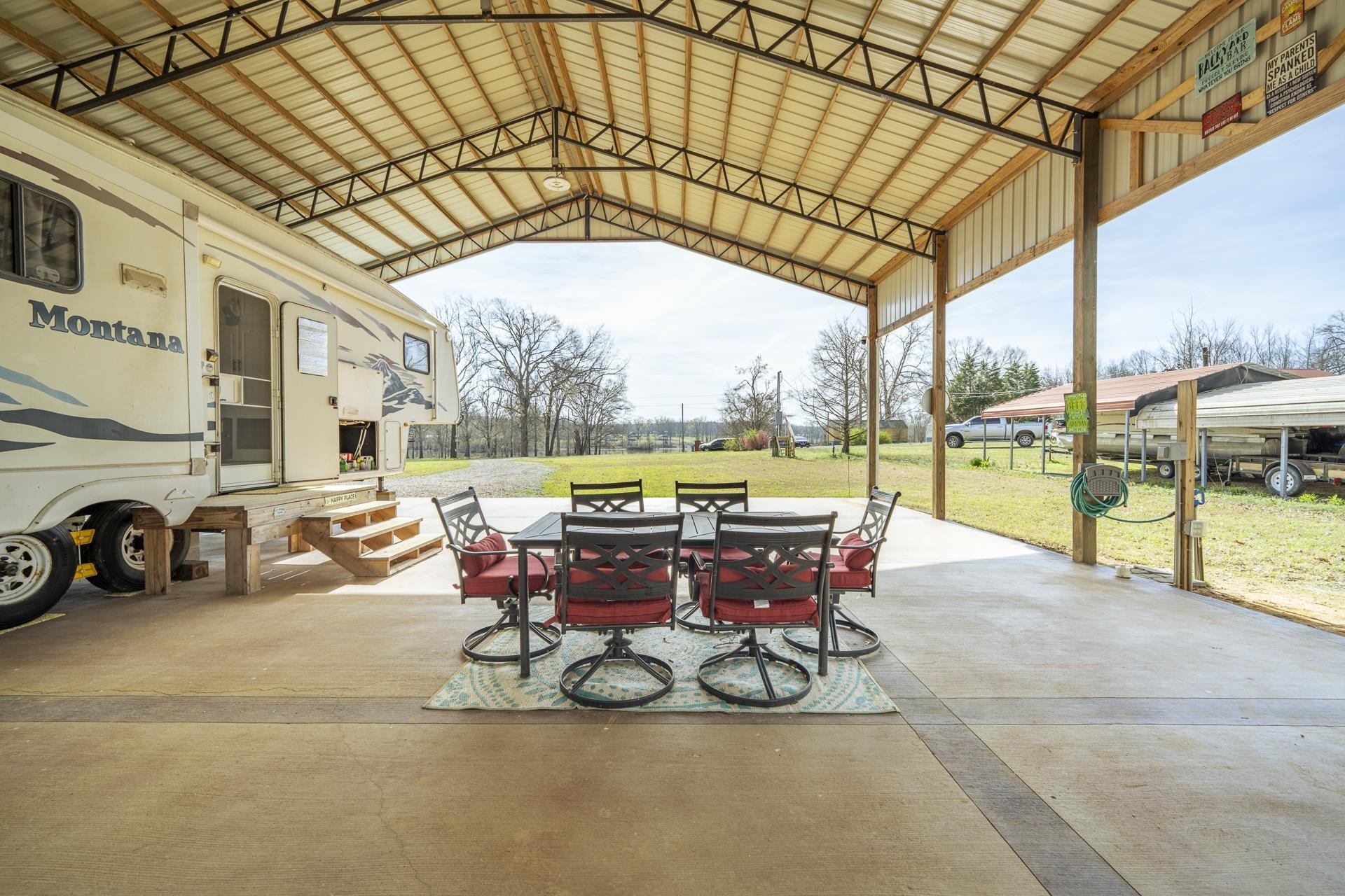 Image 3: View of patio with outdoor dining space