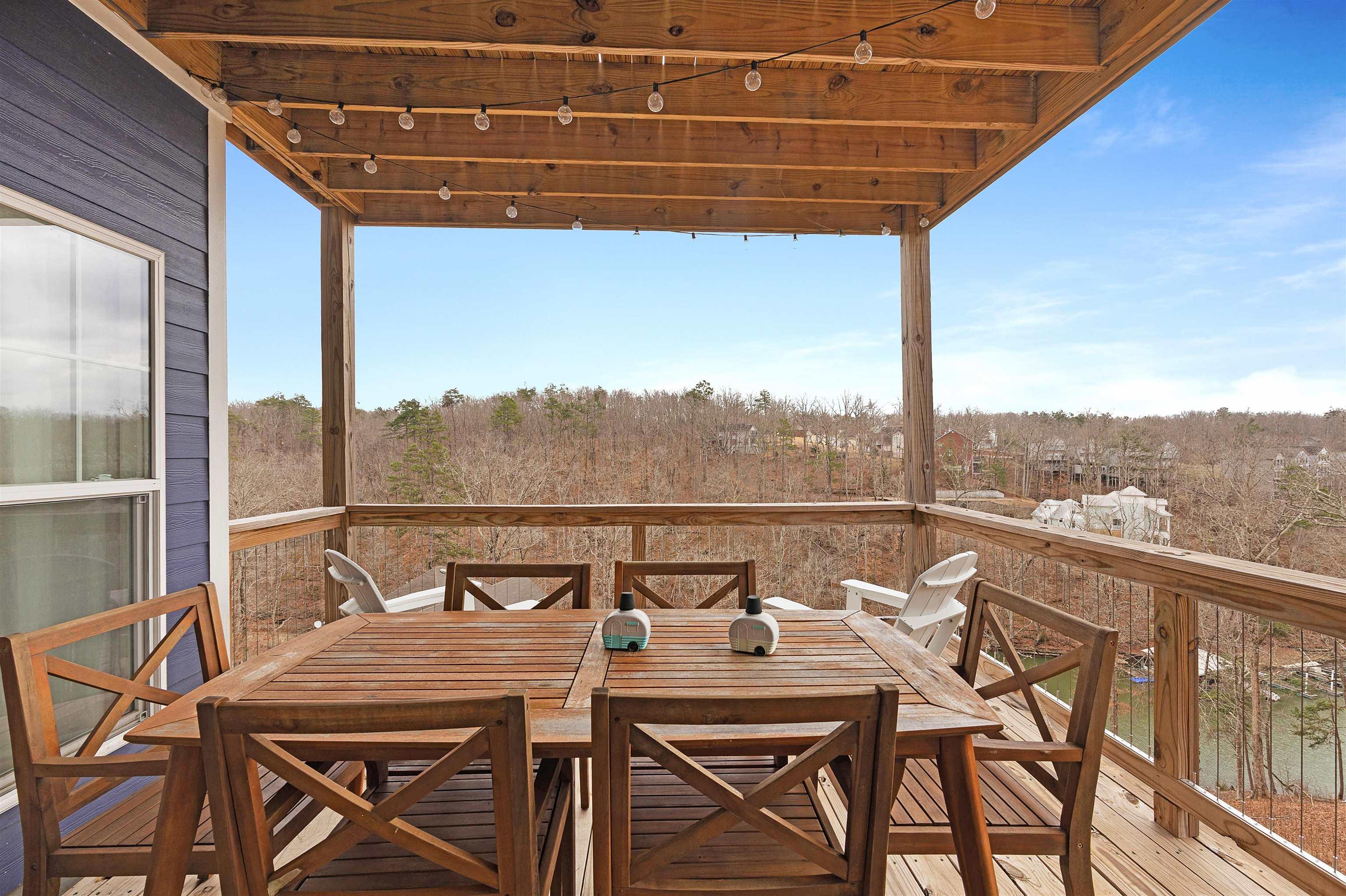 Image 4: Wooden terrace featuring outdoor dining area