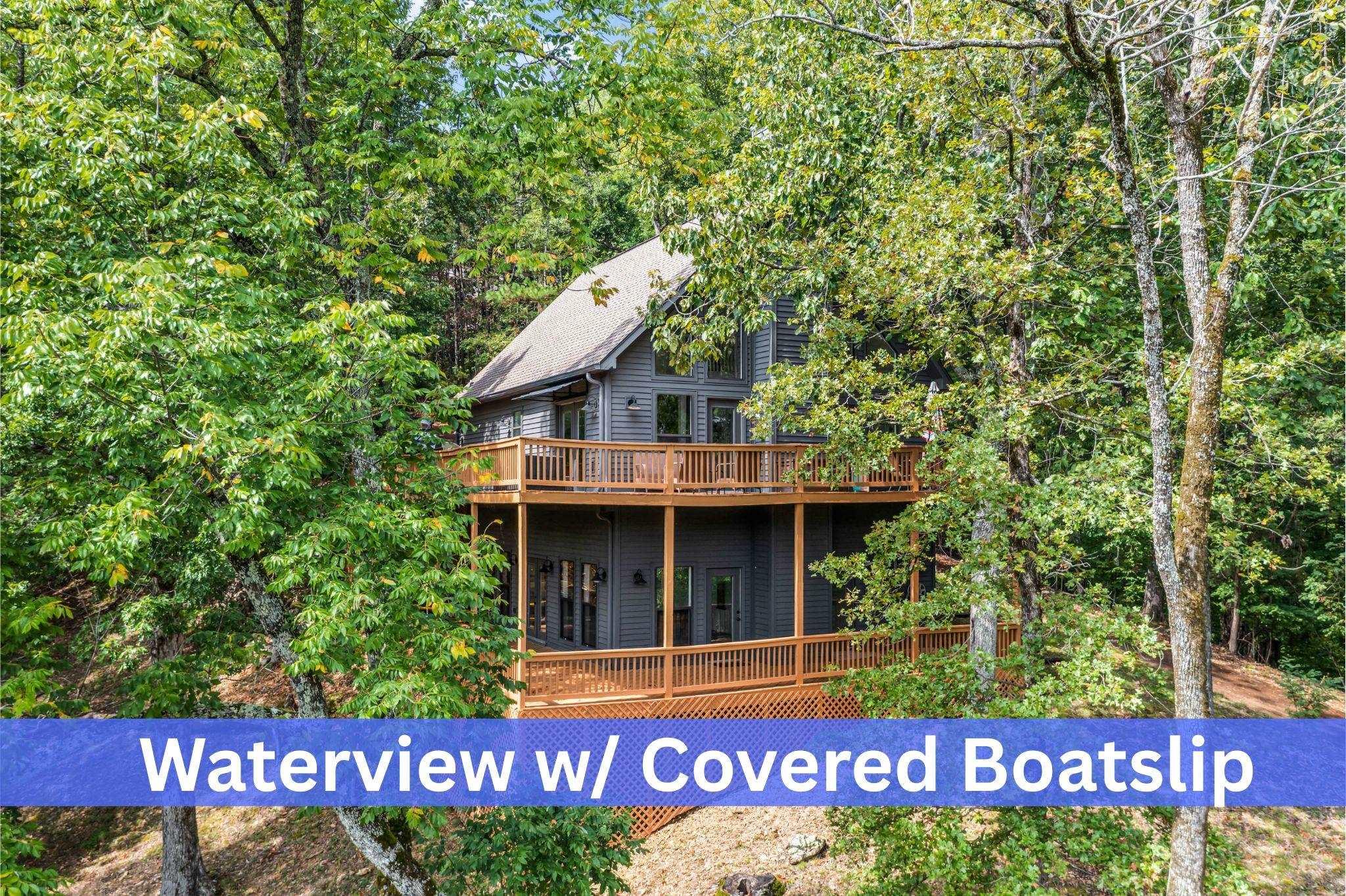 Image 1: Back of property featuring a wooden deck