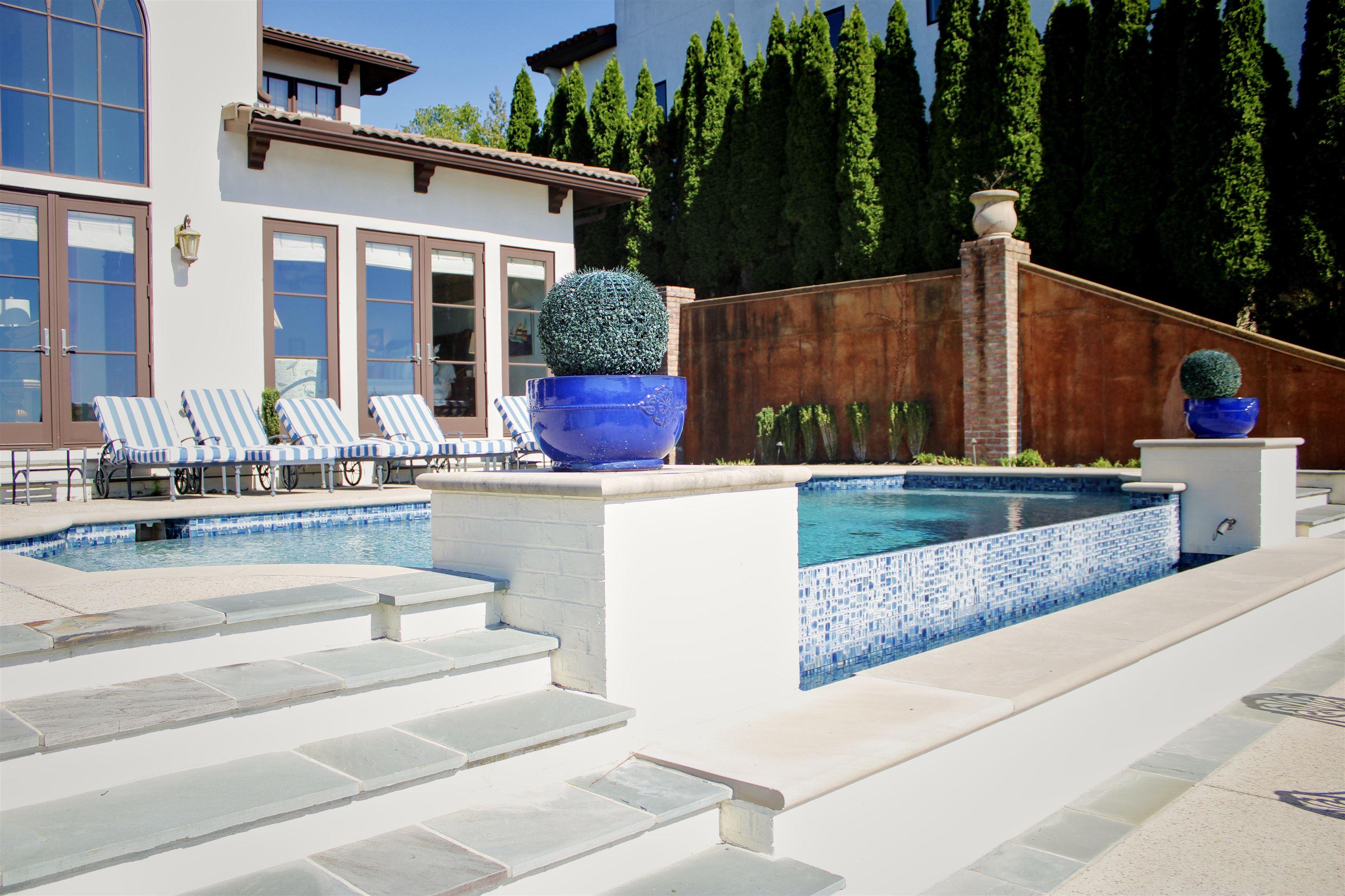 Image 2: View of swimming pool featuring a patio