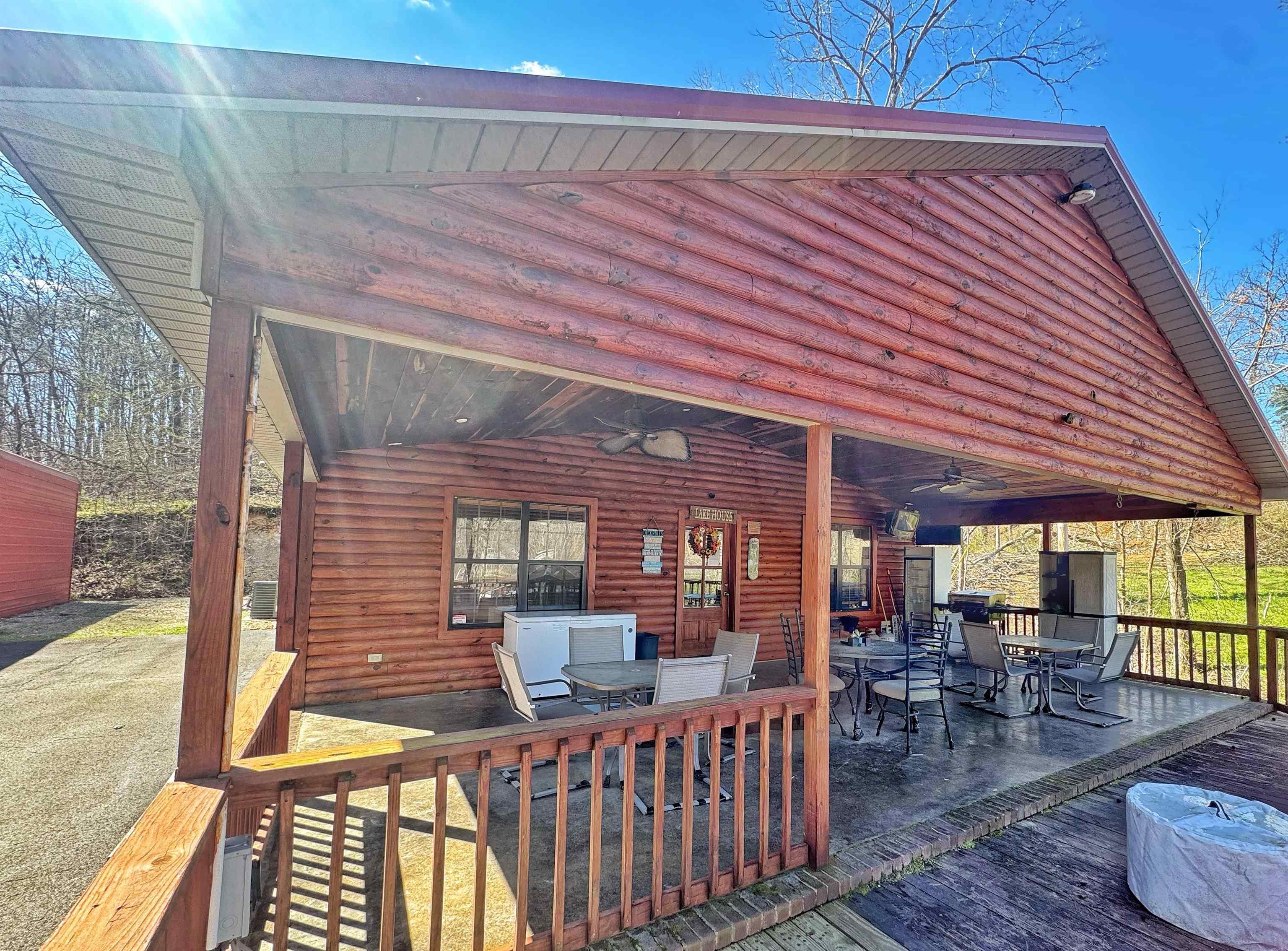 Image 2: Wooden terrace featuring a patio, outdoor dining space, and a ceiling fan
