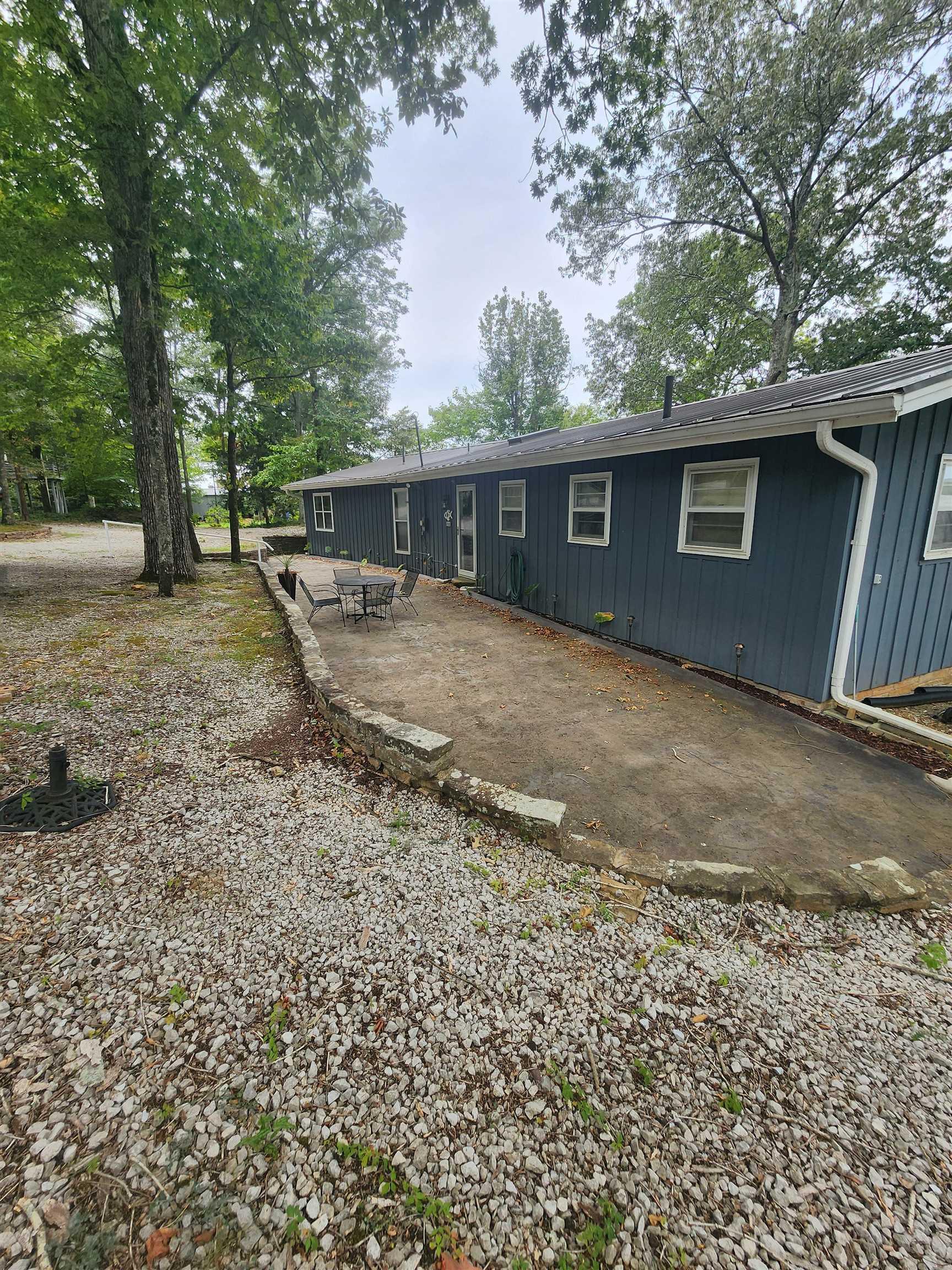 Image 3: Rear view of house with a patio