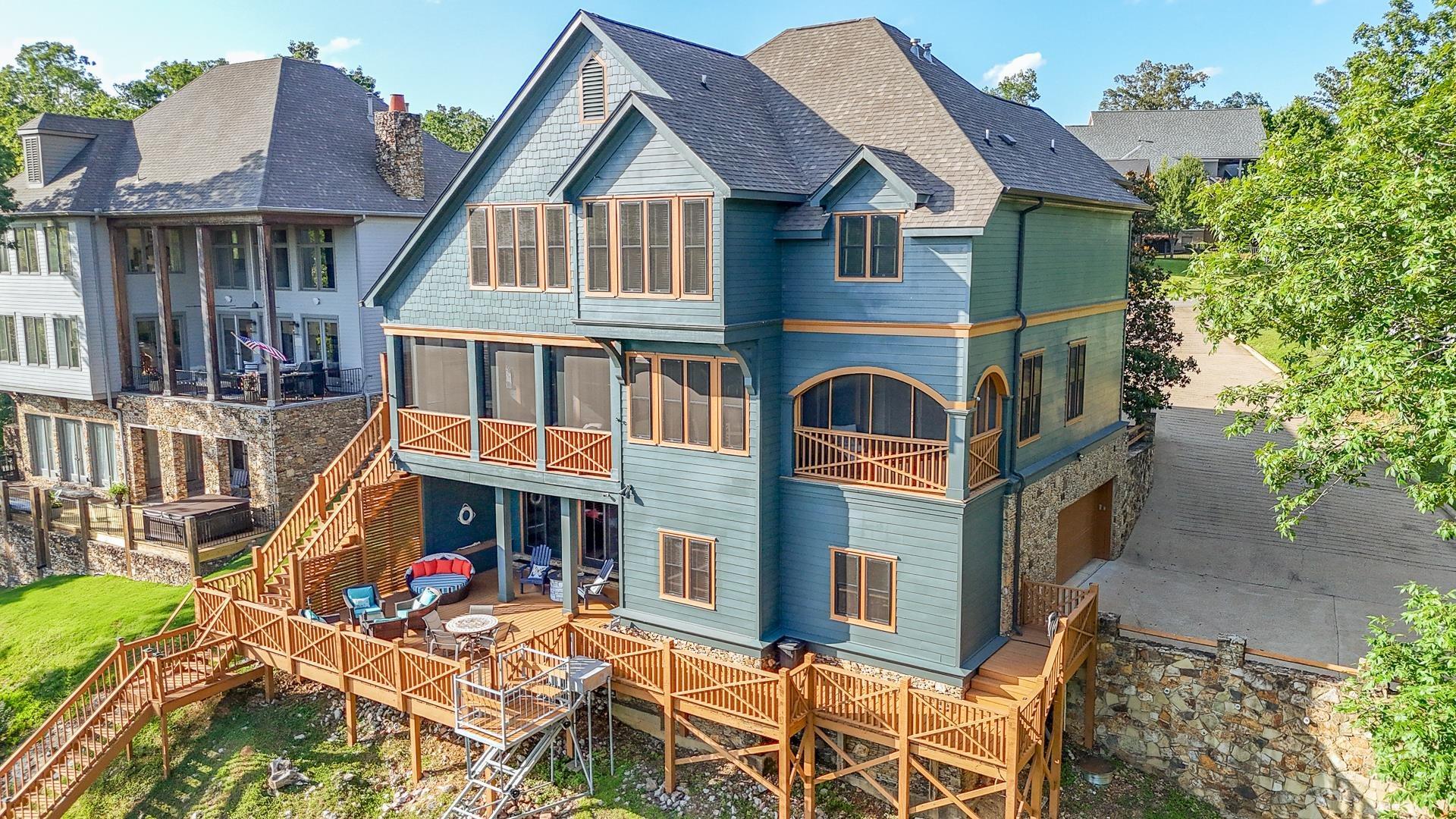 Image 4: Rear view of property featuring stairs