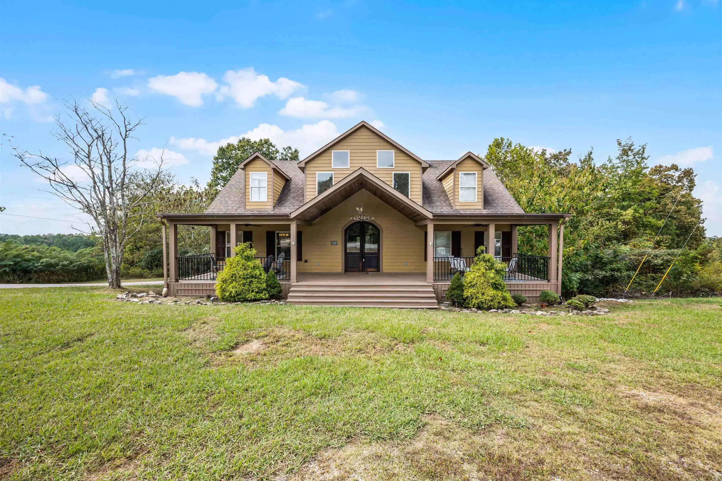 Image 1: View of front of house featuring a porch, a front yard, and roof with shingles