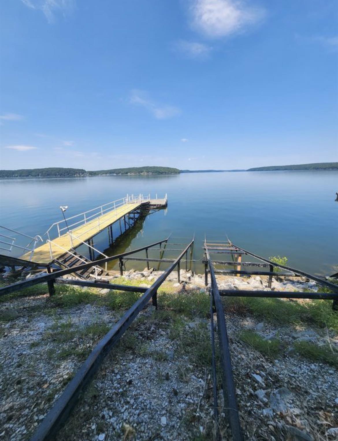 Image 2: Private dock extending into calm waters