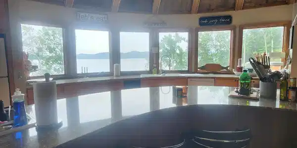 Image 4: Bar area with healthy amount of natural light, recessed lighting, and a sink