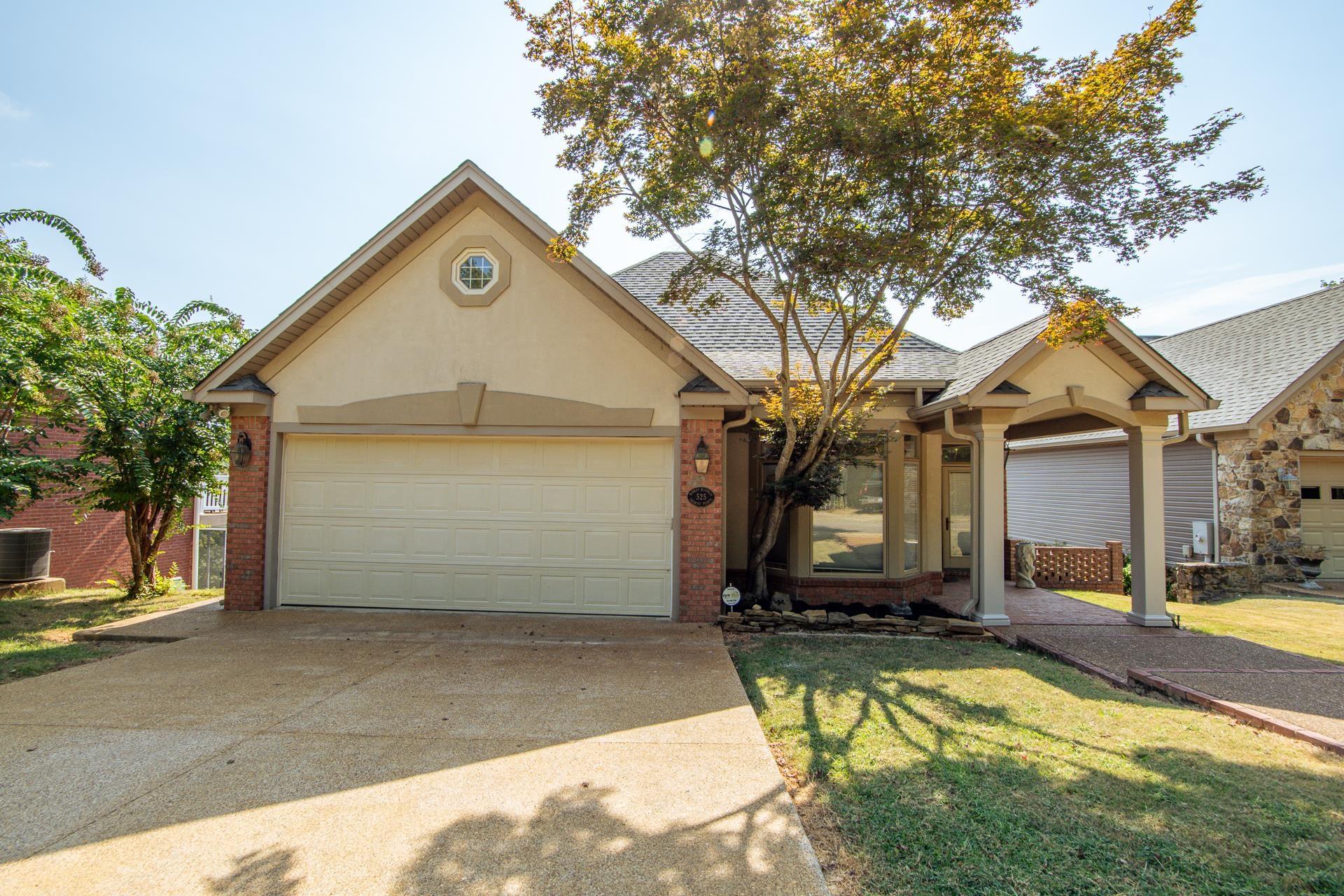 Image 2: Ranch-style house featuring concrete driveway, brick siding, a shingled roof, and a garage