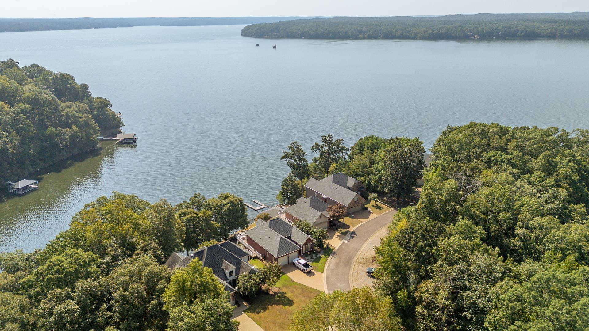Image 4: Bird's eye view of a large body of water and a heavily wooded area