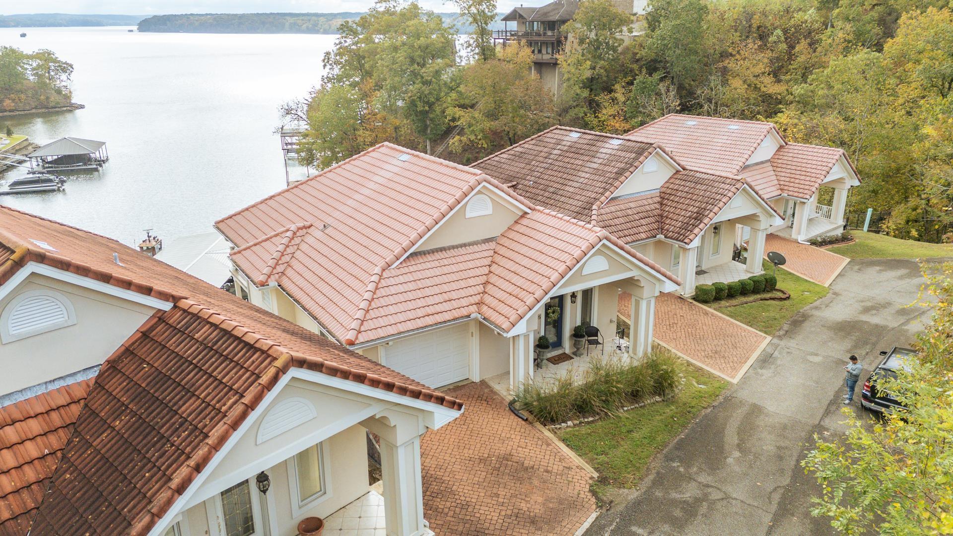 Image 1: View of subject property with a nearby body of water
