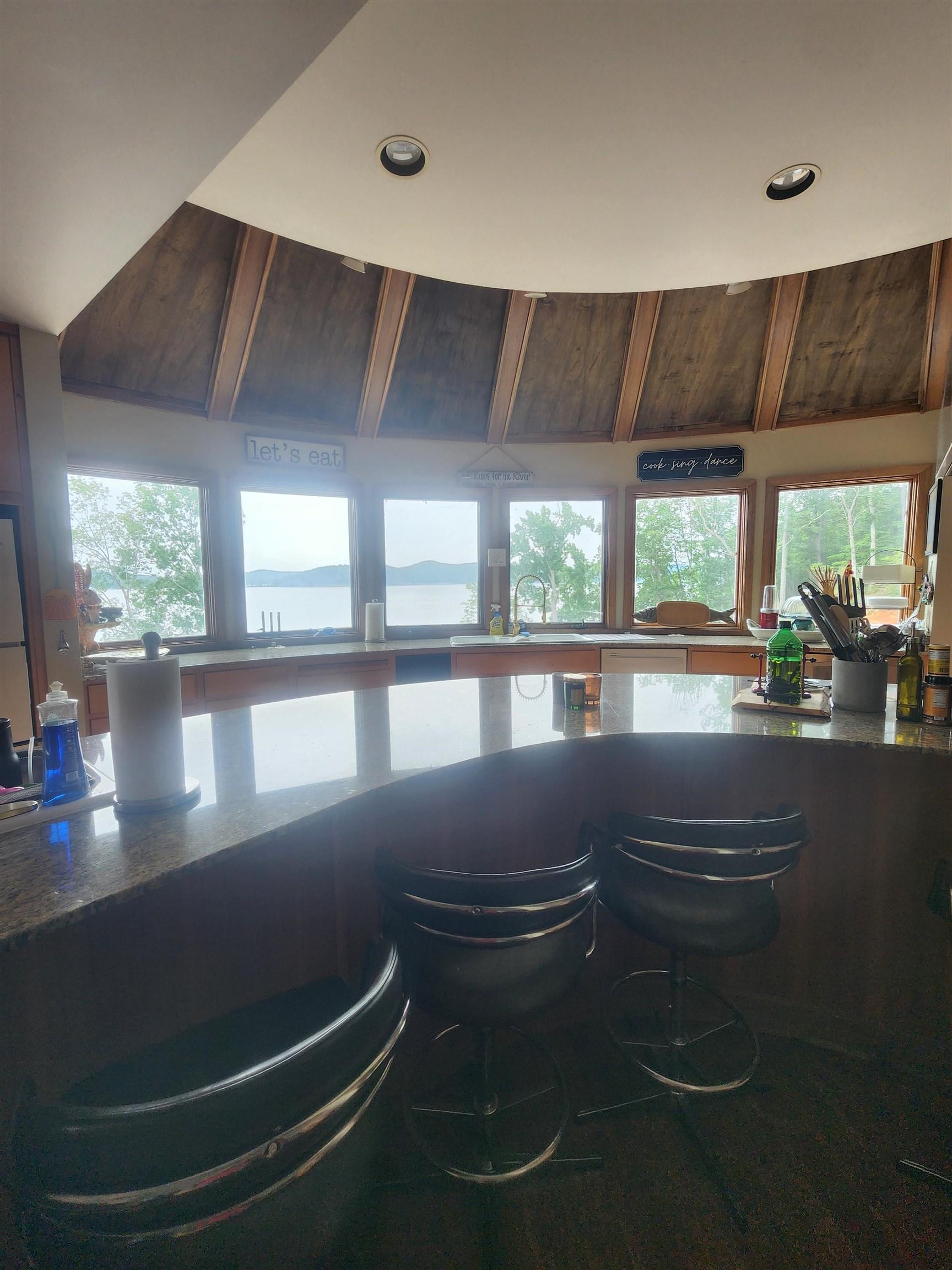 Image 4: Bar area with healthy amount of natural light, recessed lighting, and a sink