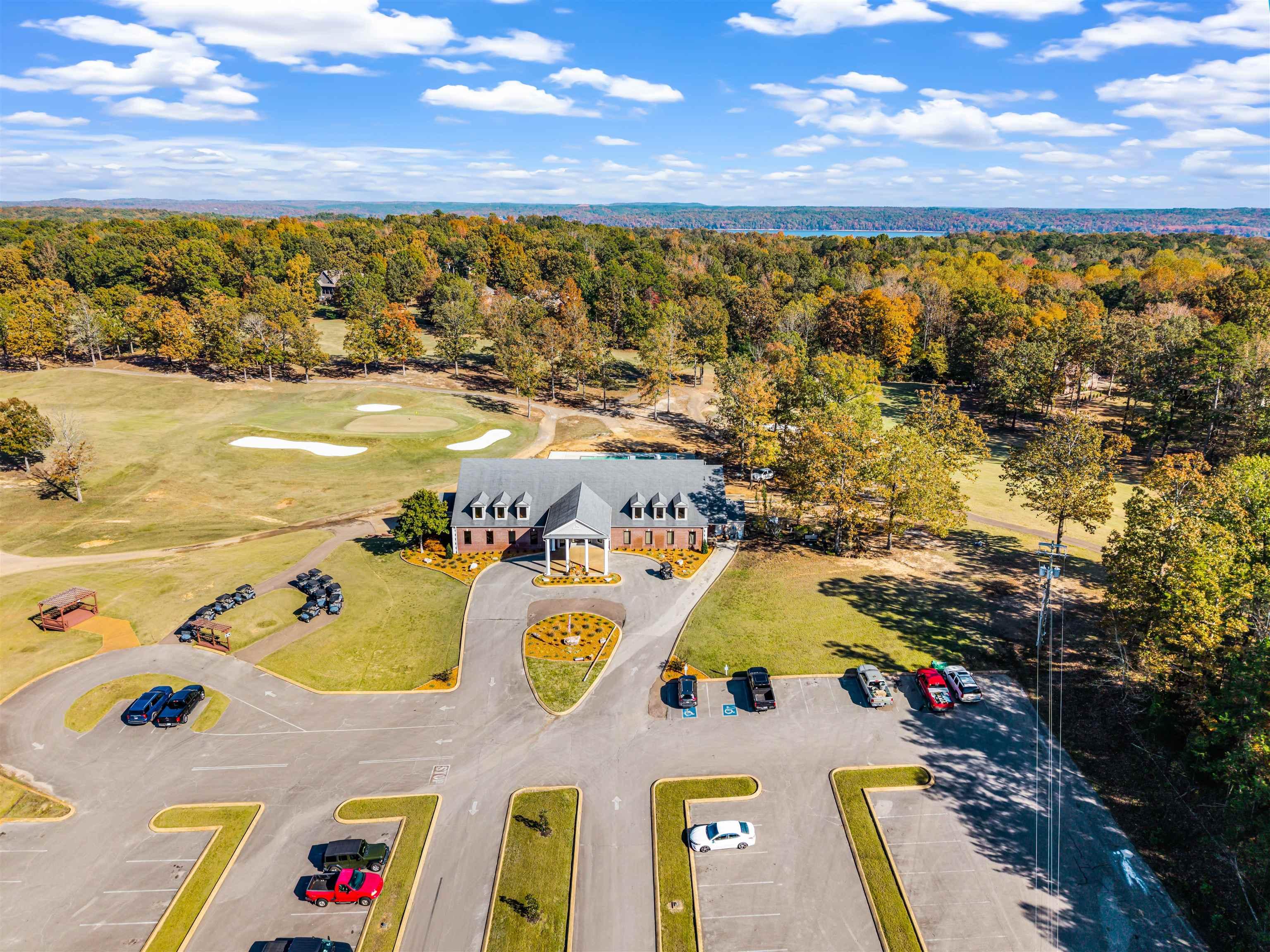 Image 3: Aerial view of a golf course and a heavily wooded area