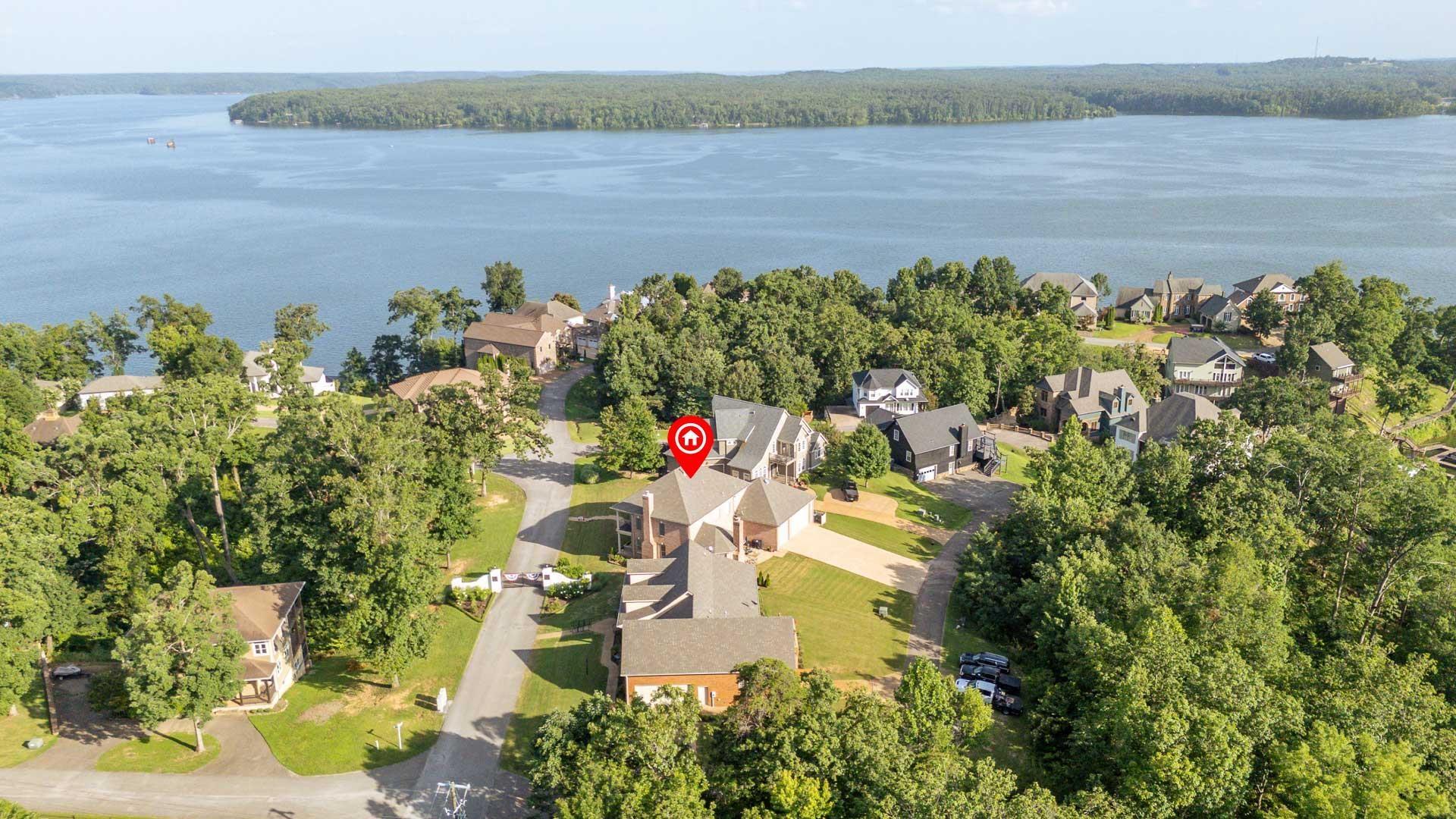 Image 4: Aerial perspective of a residential community with a waterfront setting