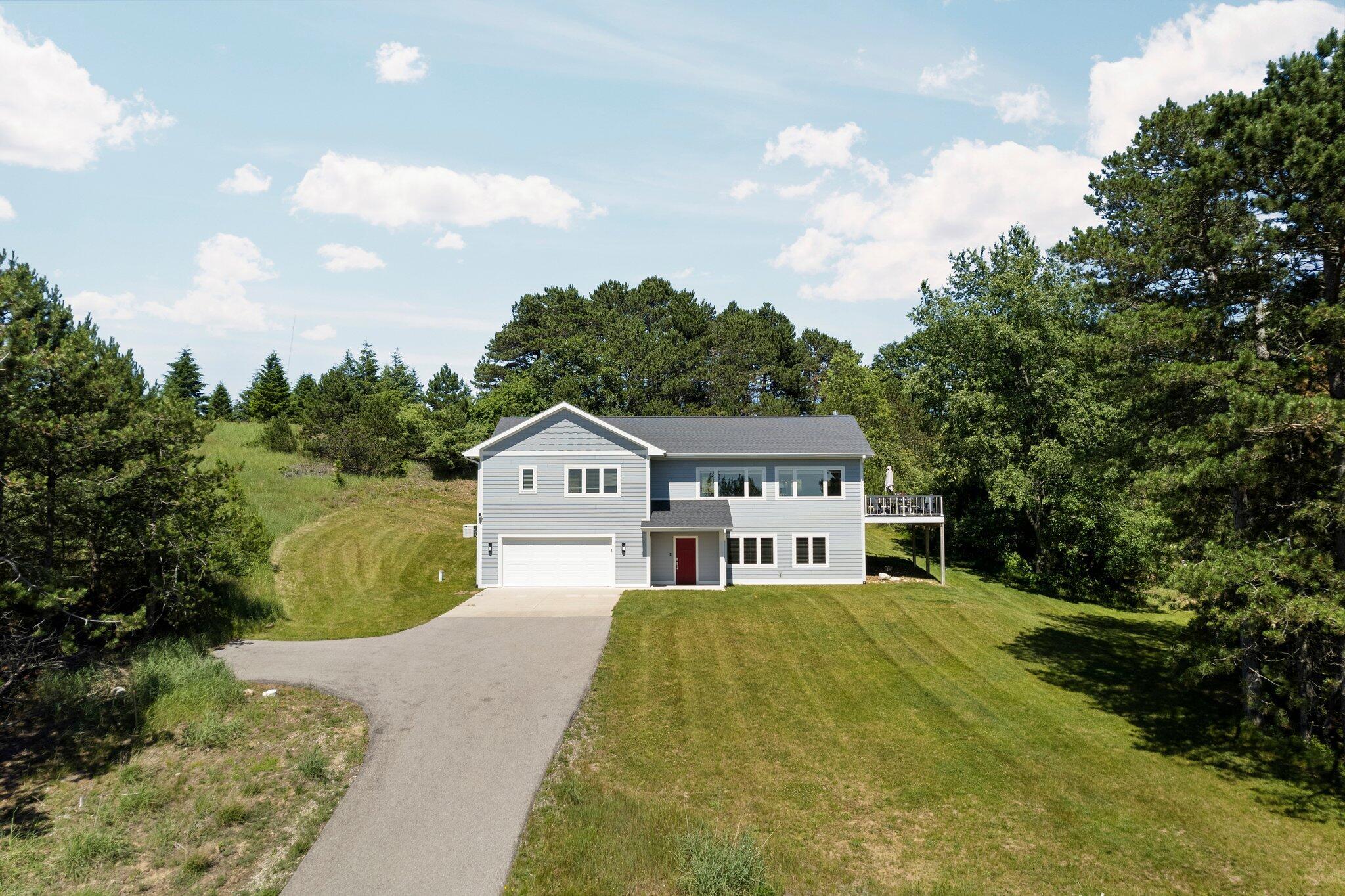 Image 1: Paved driveway with extra parking pad