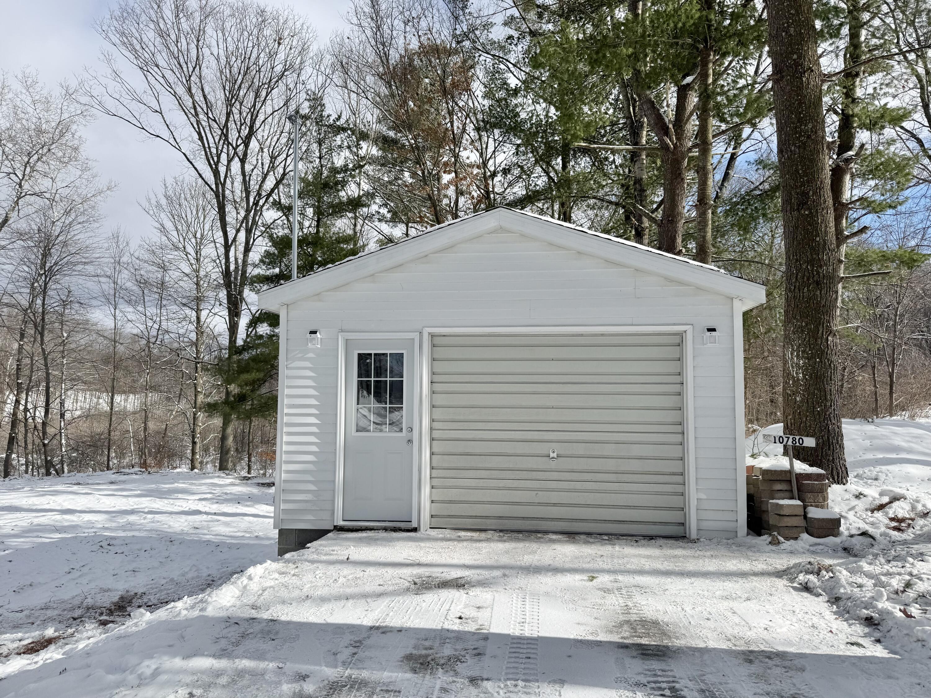 Image 2: Driveway view of garage
