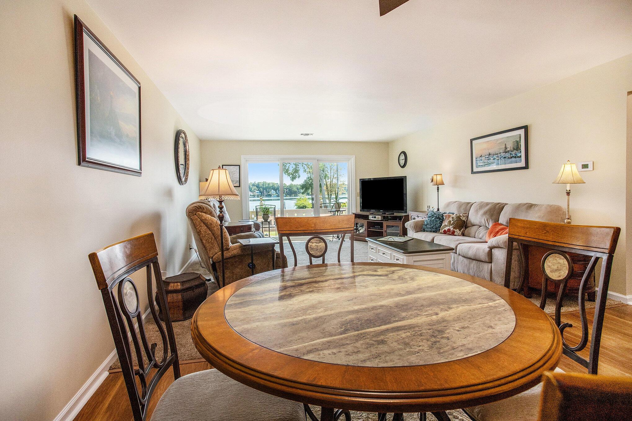 Image 4: DINING AREA AND LIVING ROOM VIEW