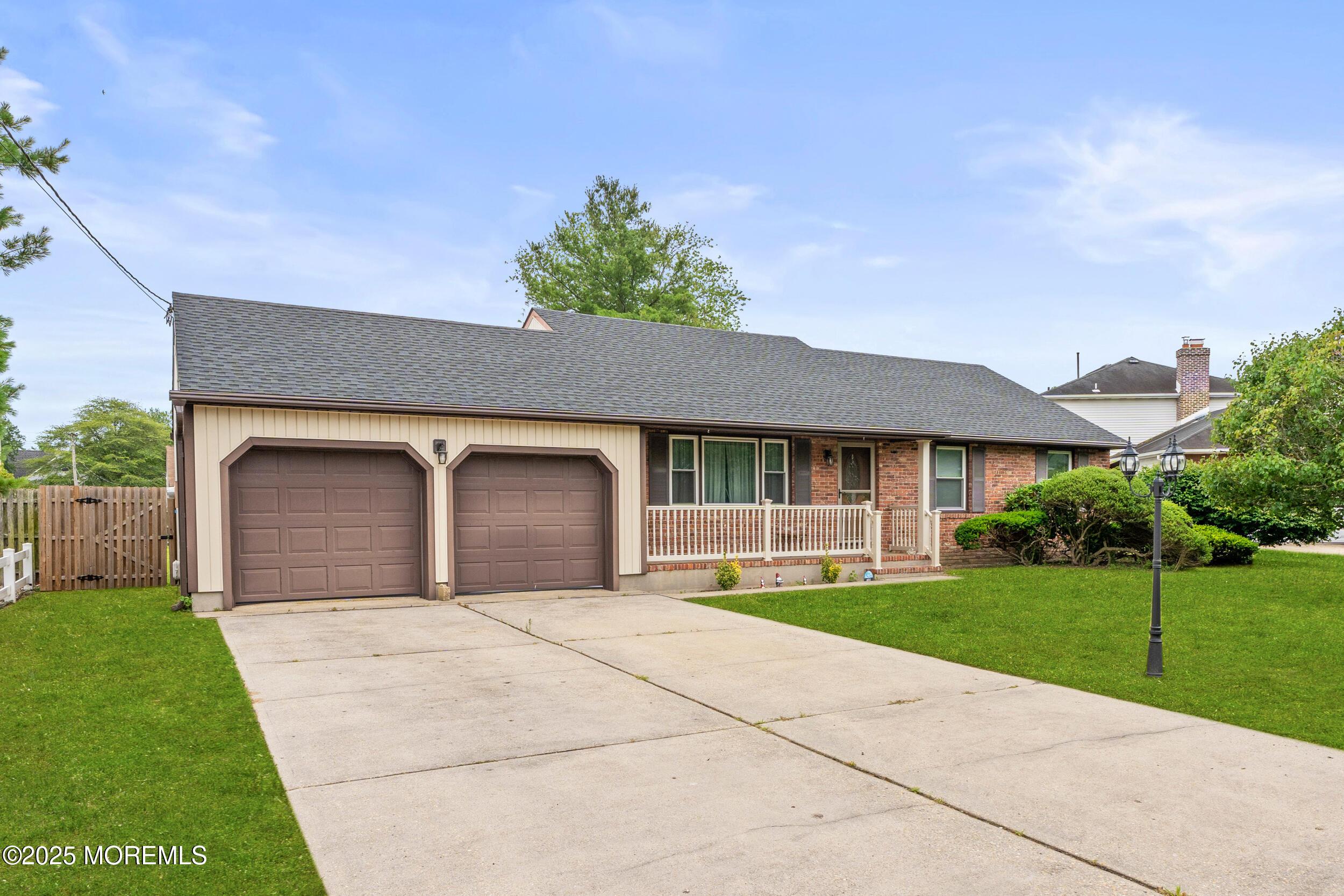 Image 2: 2 Car Garage/Wide Driveway
