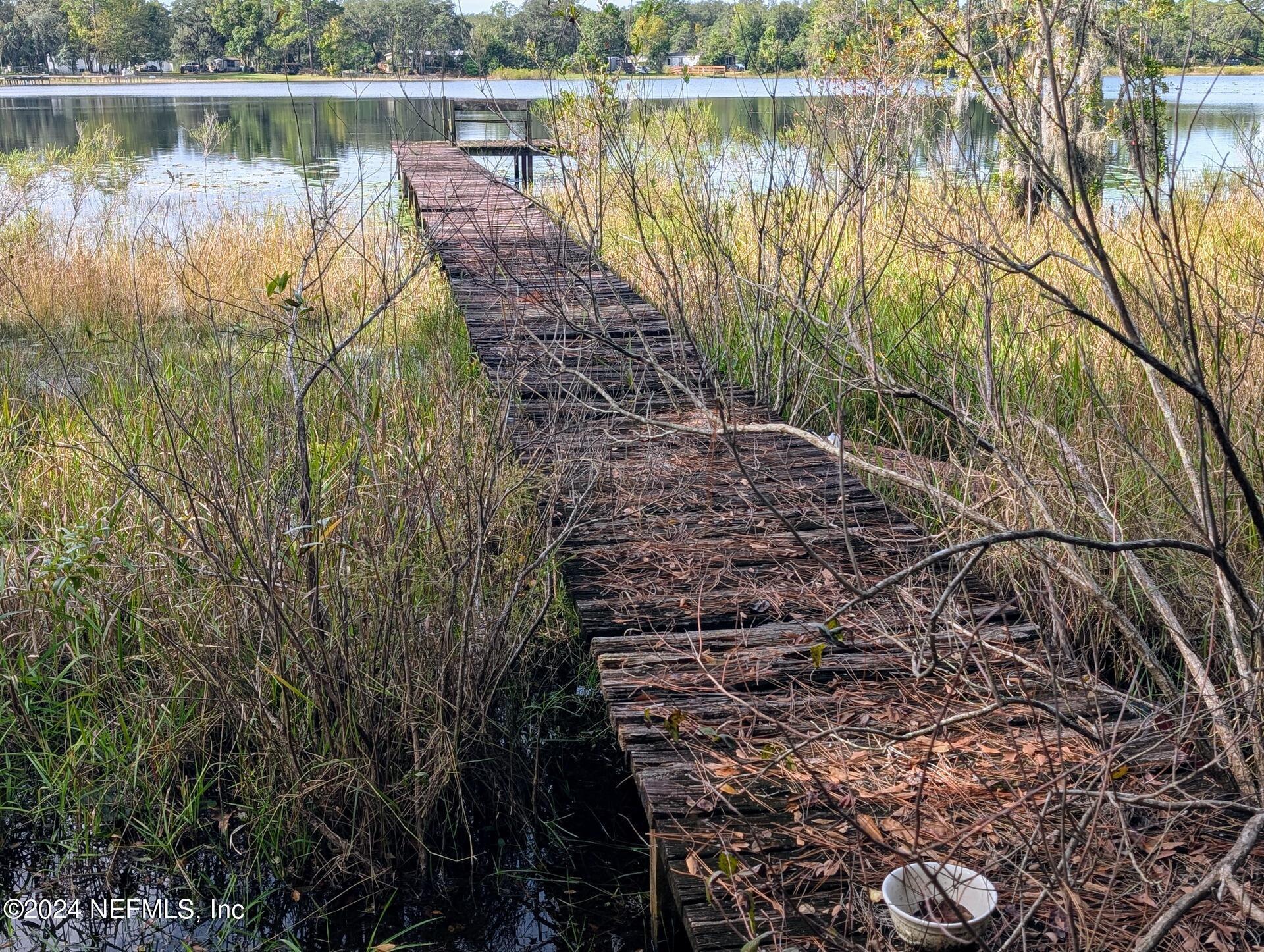 Image 2: Abandoned Wooden Dock By Lake