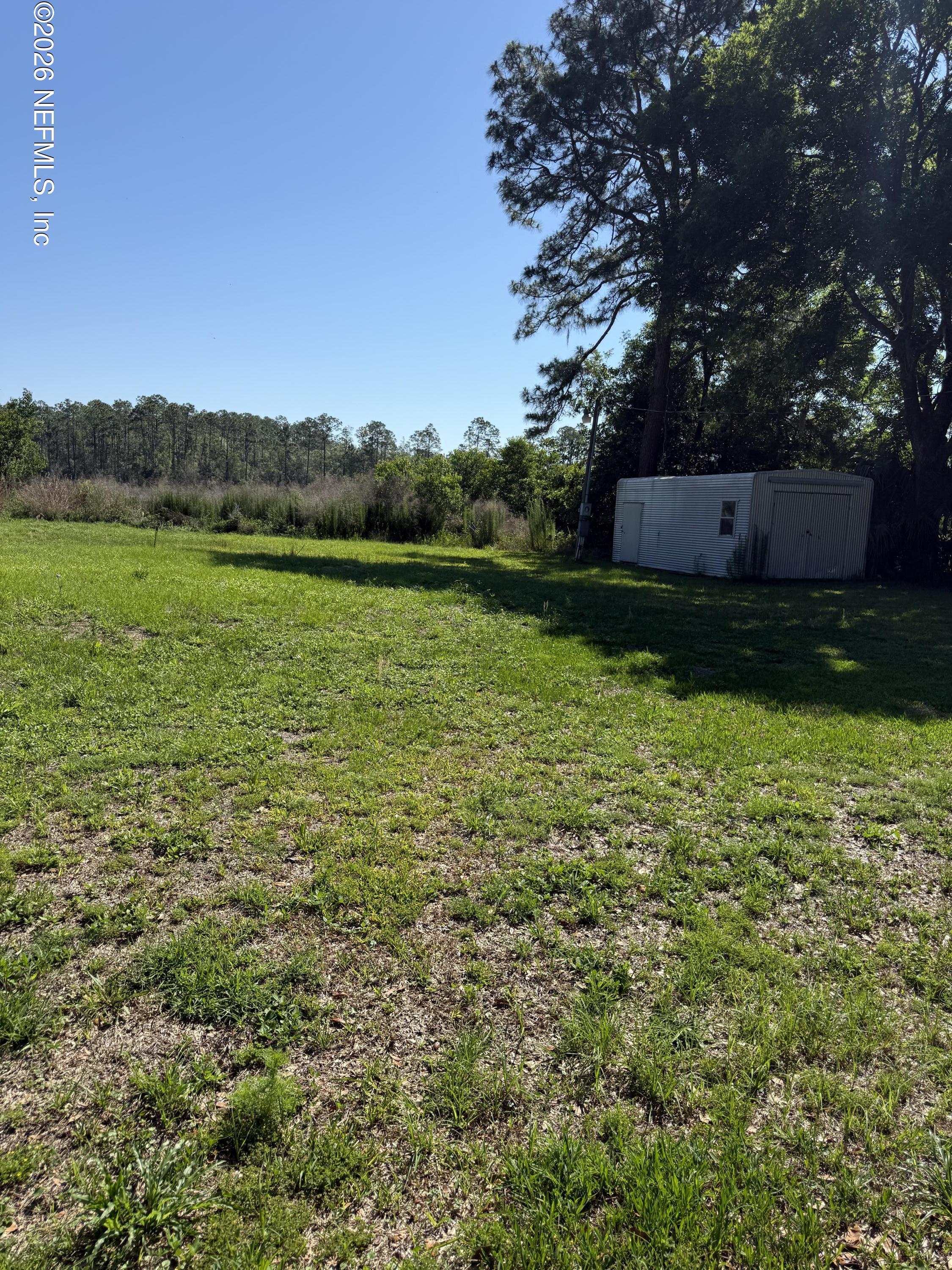 Image 1: From road including shed