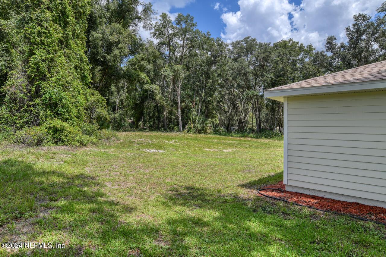 Image 4: SIDE & REAR OF HOME