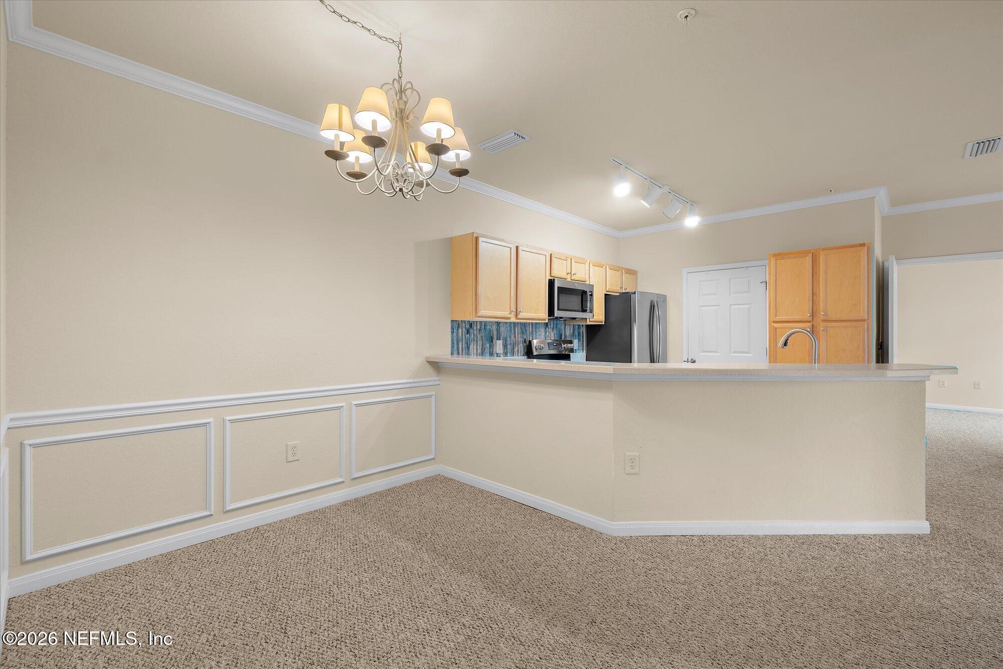 Image 2: Dining and Kitchen