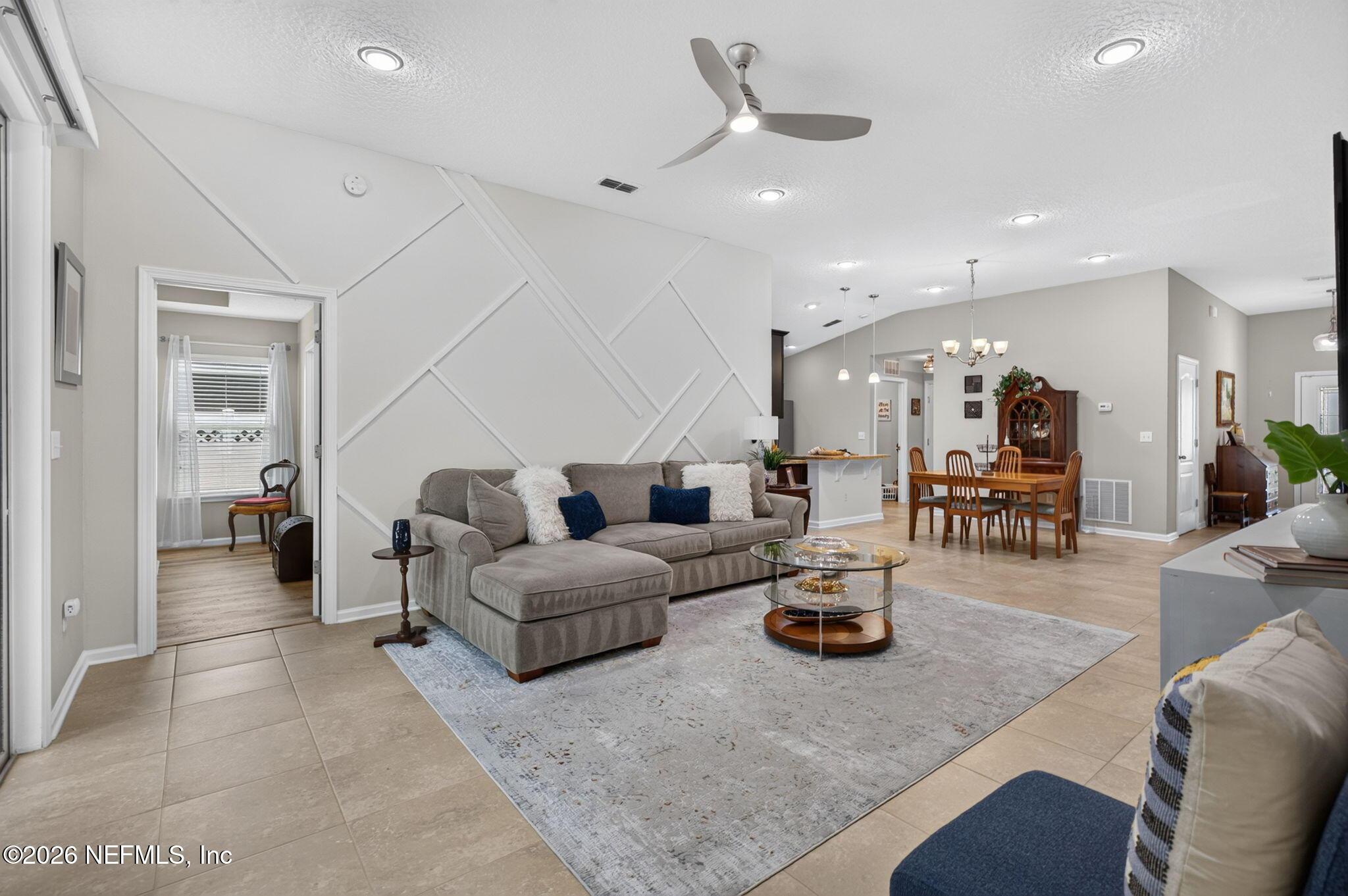 Image 3: Great room with decorative wall