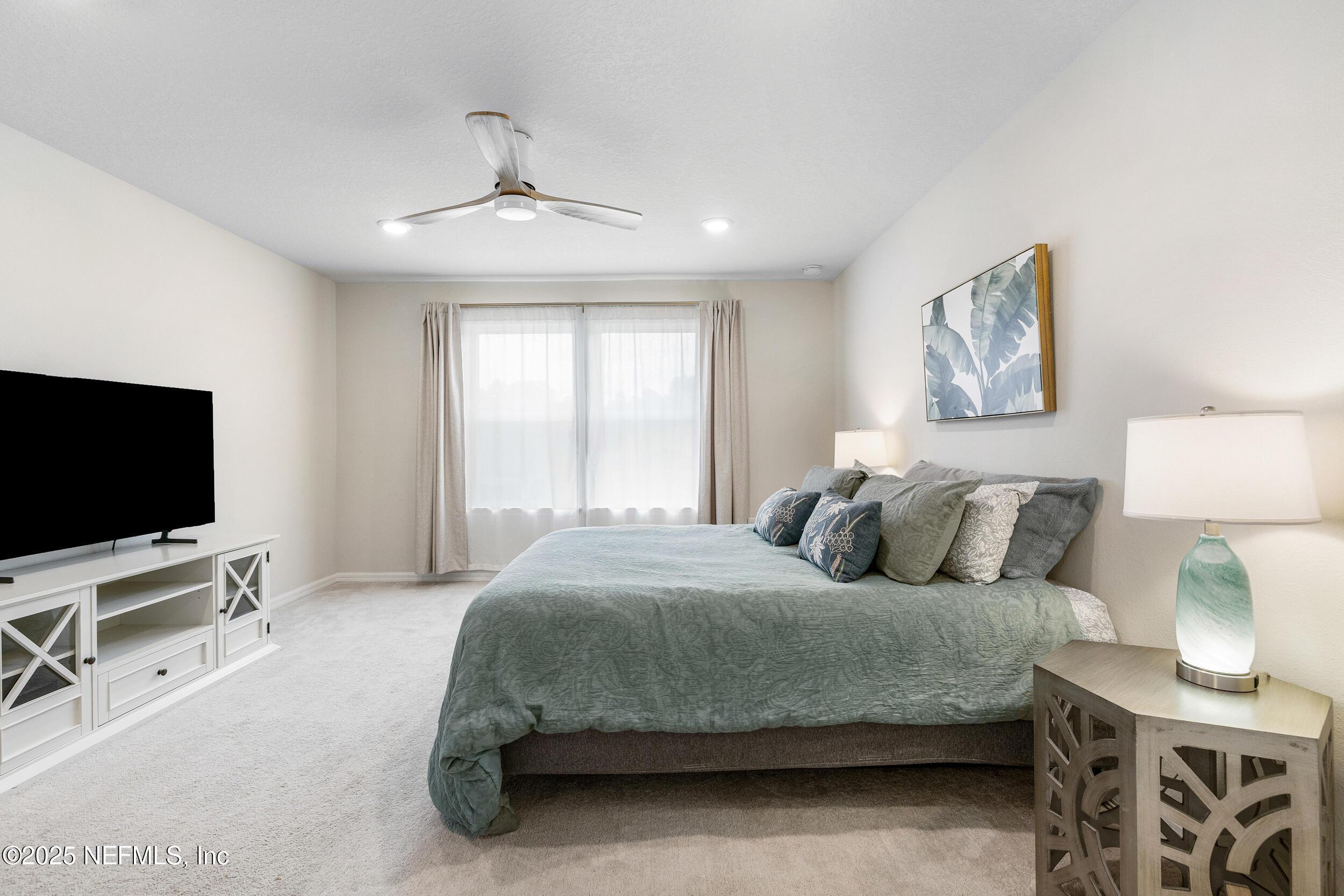 Image 3: Primary Bedroom w Large Windows