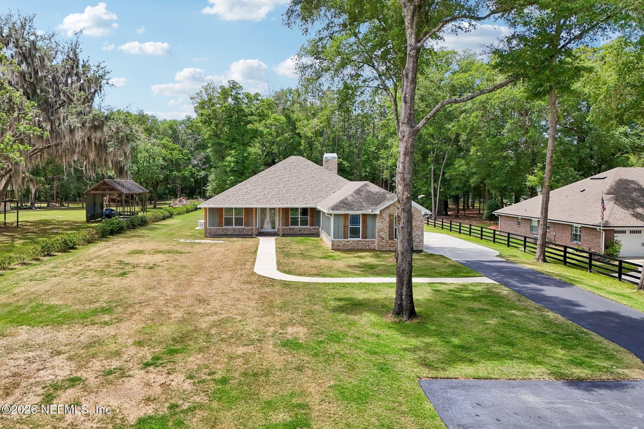 Image 3: elevated with driveway view