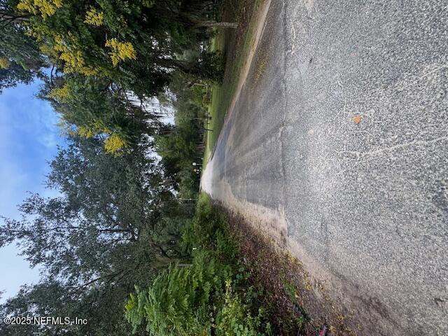 Image 1: Entrance, corner lot