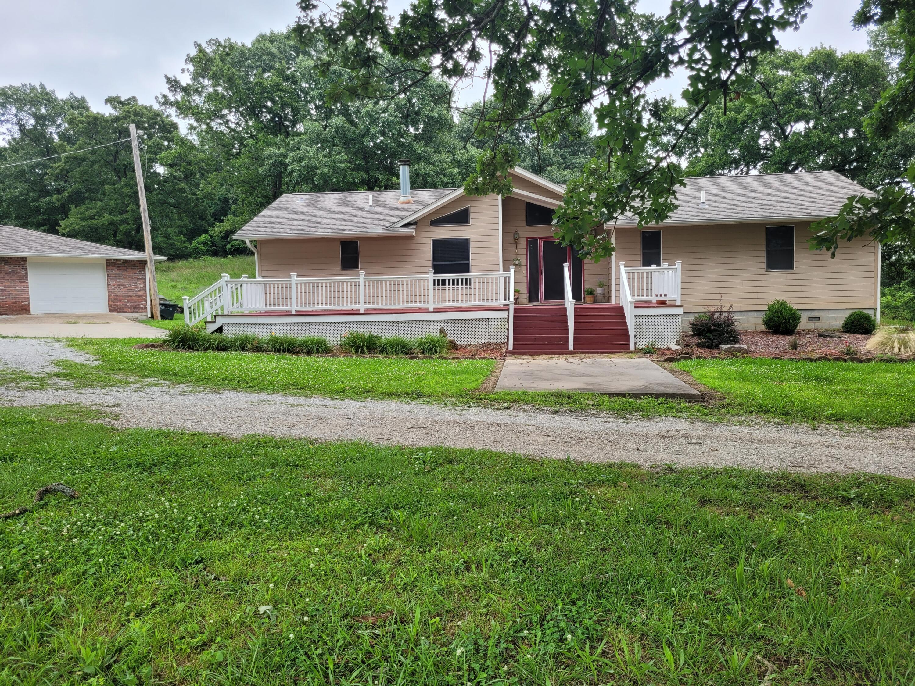 Image 3: View of Home and 1-car garage