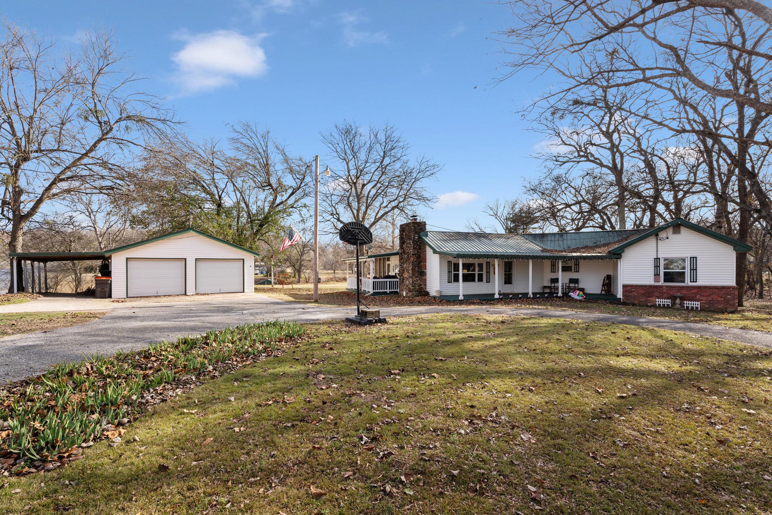 Image 1: home front and garage