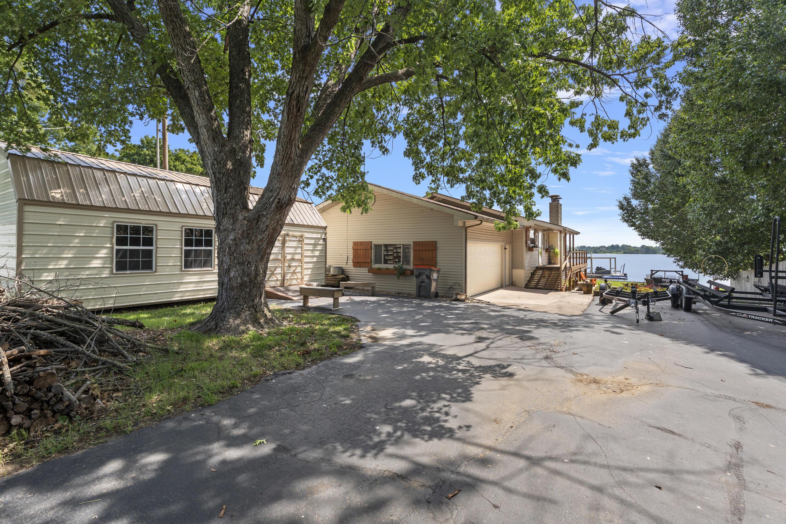 Image 1: Front Exterior & Driveway